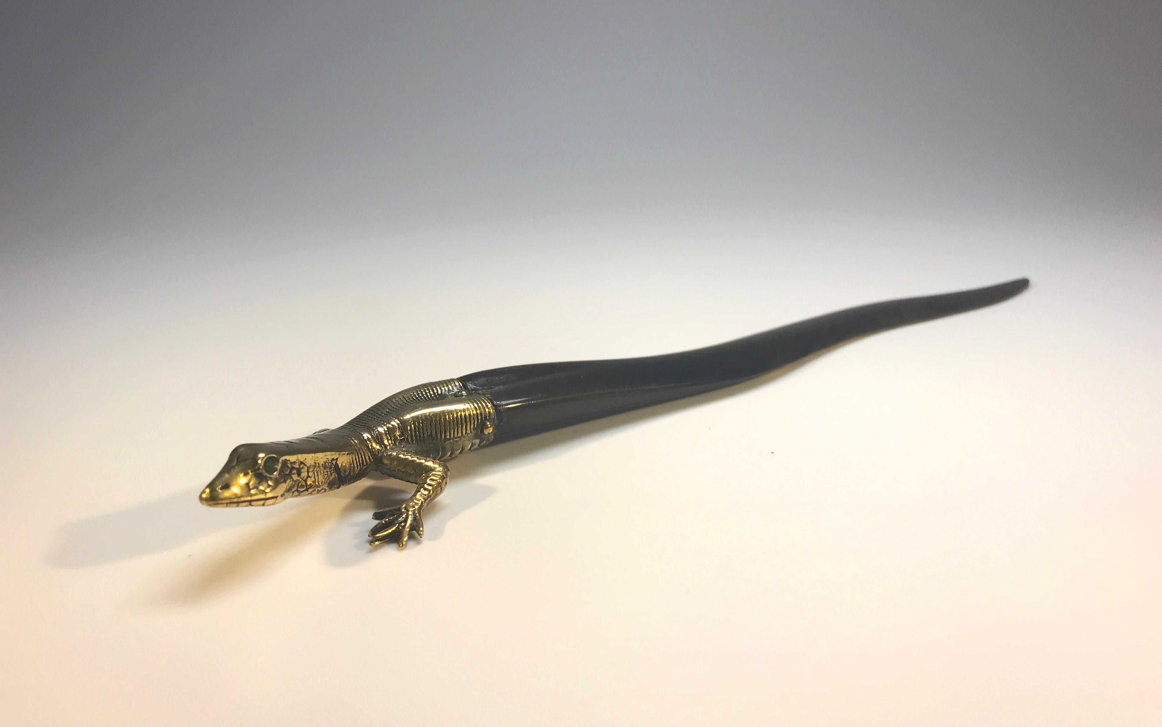 Decorative brass and tortoiseshell colored horn 'Italian Ruins Lizard' letter opener.
Quite possibly Austrian
Although this piece has issues, it is utterly endearing and collectible,
circa late 19th century
Measures: Height 0.6 inch, width 1.25