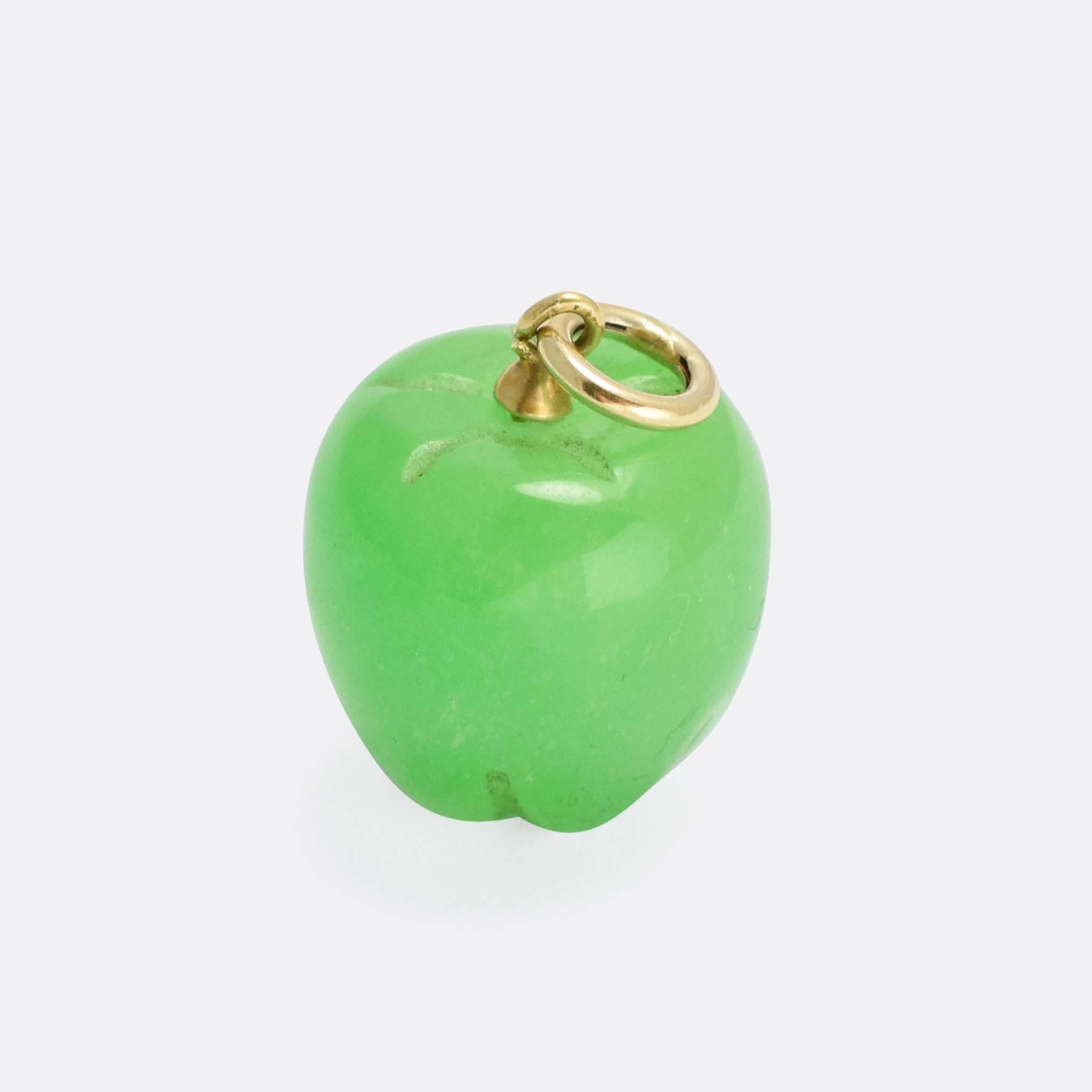 A cool antique Green Apple pendant, the fruit is carved from a single piece of apple-green jade. A simple gold bail has been added for wear as a pendant, or as part of a charm collection. Especially lovely, and quite
