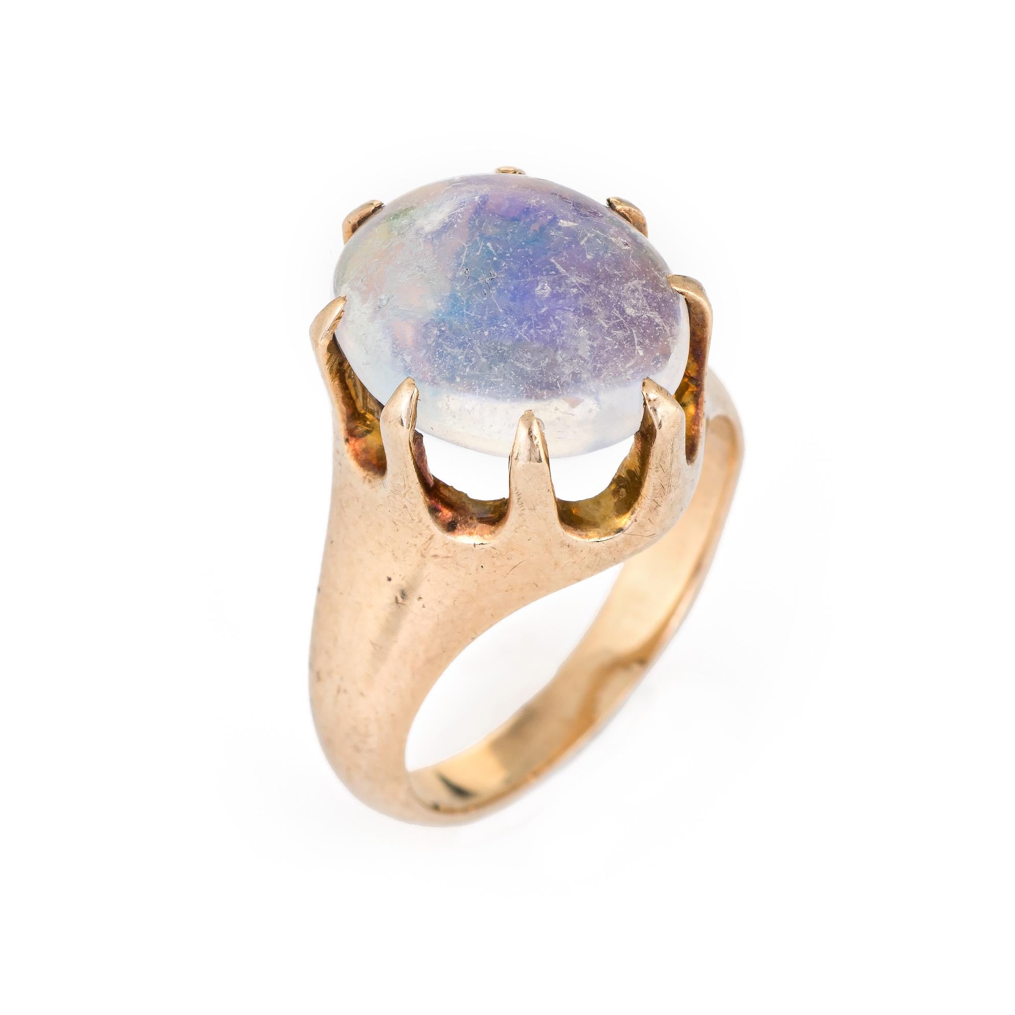 Finely detailed antique Victorian jelly opal ring (circa 1880s to 1900s) crafted in 10 karat yellow gold. 

Natural cabochon cut opal measures 12mm x 10mm (estimated at 4 carats). The opal is in excellent condition and free of cracks or chips (some