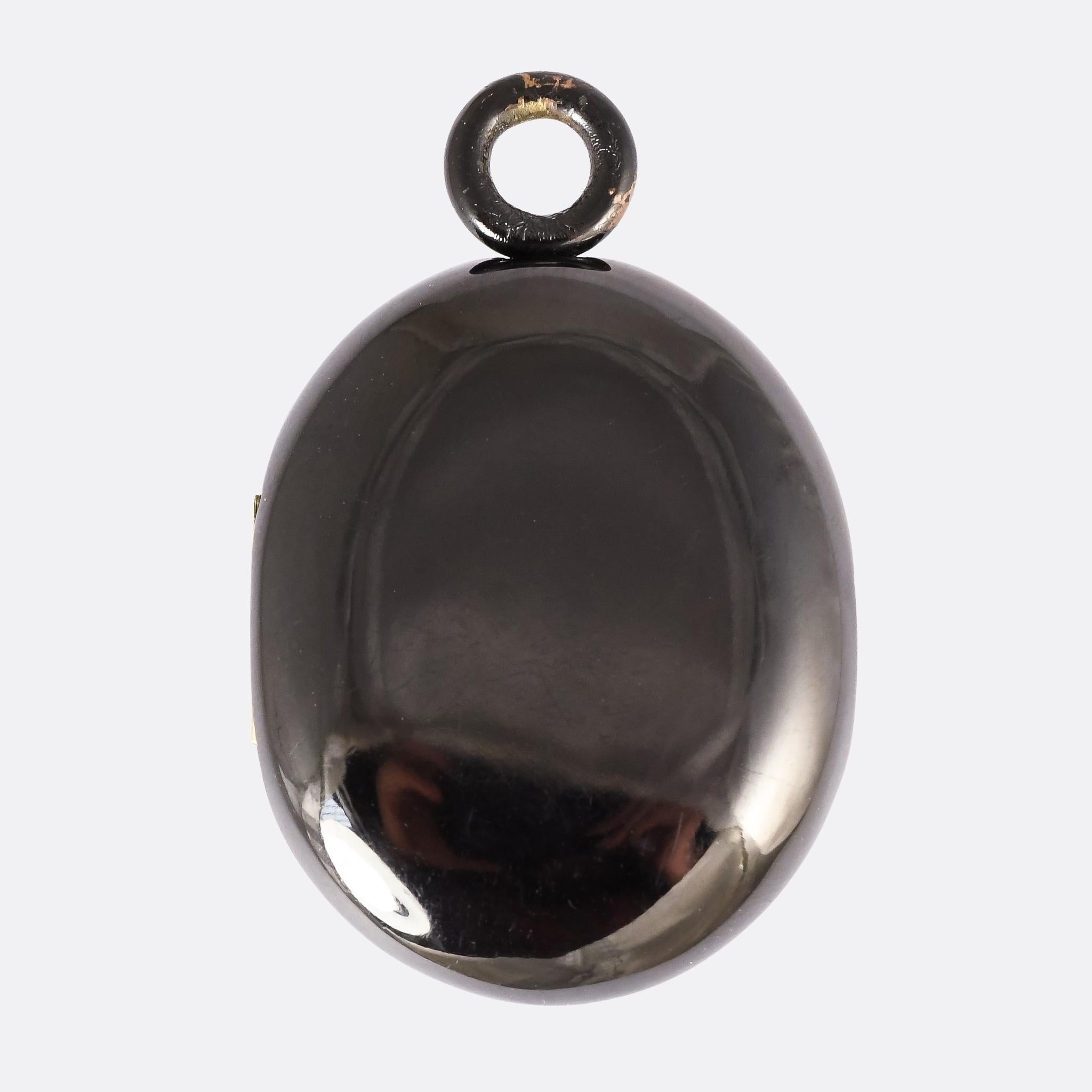 A cool antique AEI locket with silver lettering set on black jet. It dates from the mid Victorian period, circa 1870, clearly intended as a mourning/memorial piece. It's a good size (6.5 x 4.1cm) and contains two locks of hair inside behind the