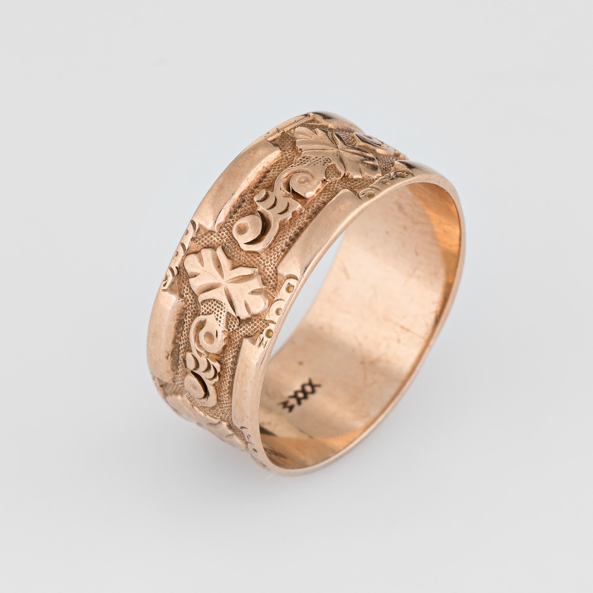 Elegant antique Victorian ring (circa 1880s to 1900s), crafted in 10 karat rose gold. 

The wedding band features a charming embossed pattern. A cartouche to the center was previously engraved with initials yet they have worn down from age. The