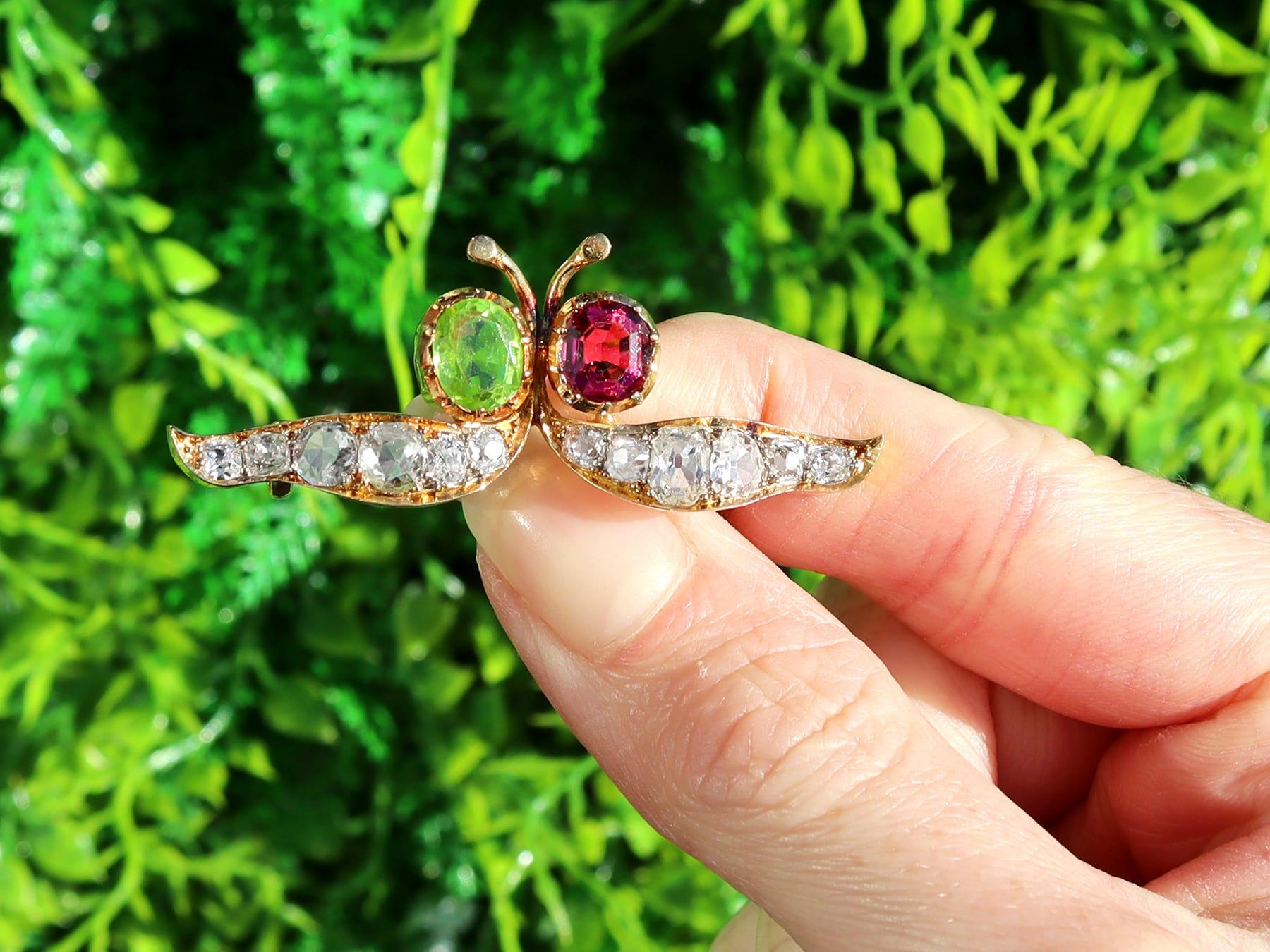 A stunning Victorian 1.23 carat kunzite and 1.12 carat peridot, 2.96 carat diamond and 18 karat yellow gold brooch; part of our diverse antique jewelry collections.

This stunning, fine and impressive antique brooch has been crafted in 18k yellow