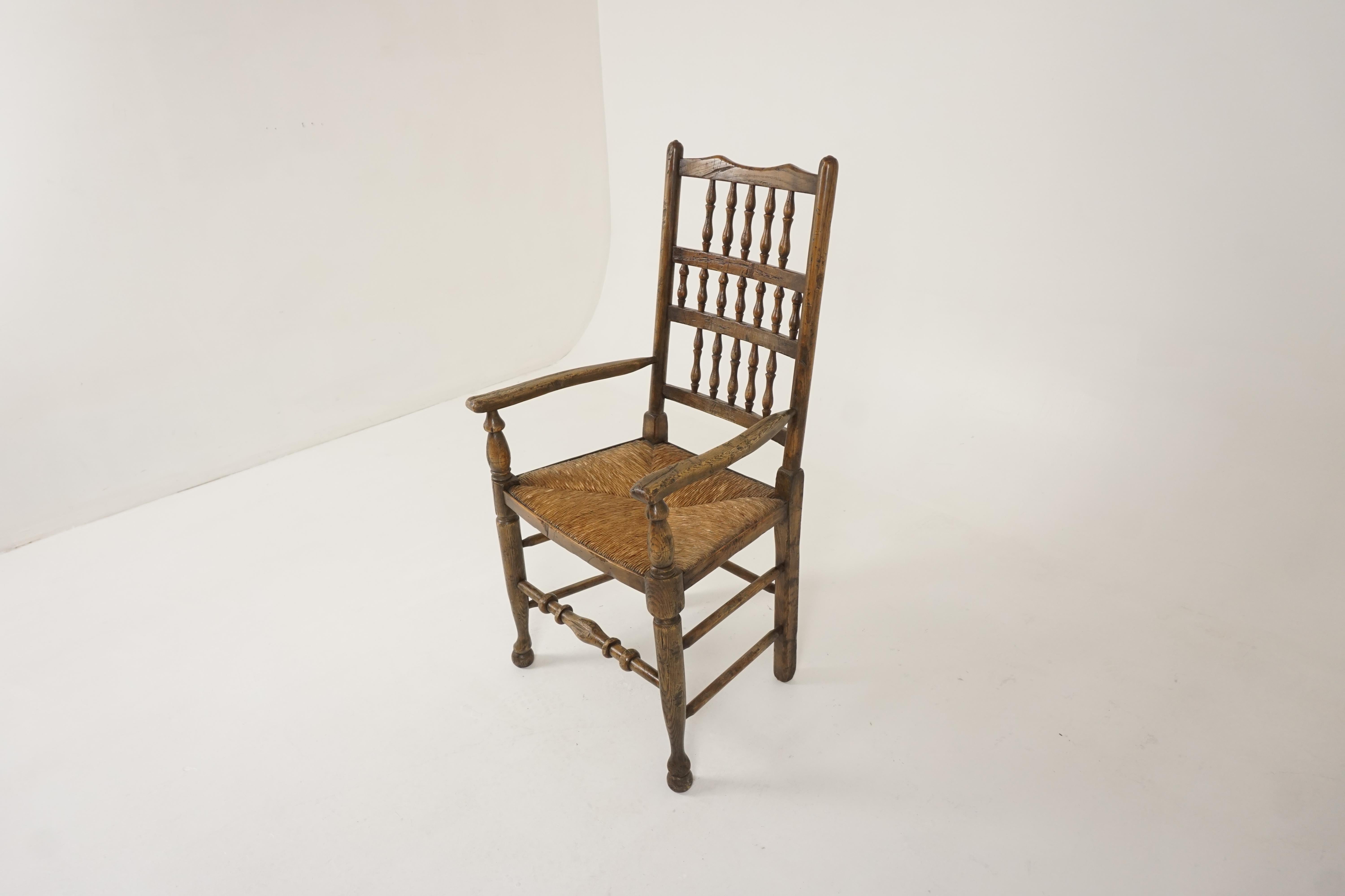 Antique Victorian Lancashire elm rush seated chair, England 1880, B2324

England 1880
Solid elm
Original finish
Lovely ladder back with 17 turned spindles
Rush seat underneath in good condition
Outswept arms
Standing on bulbous front legs