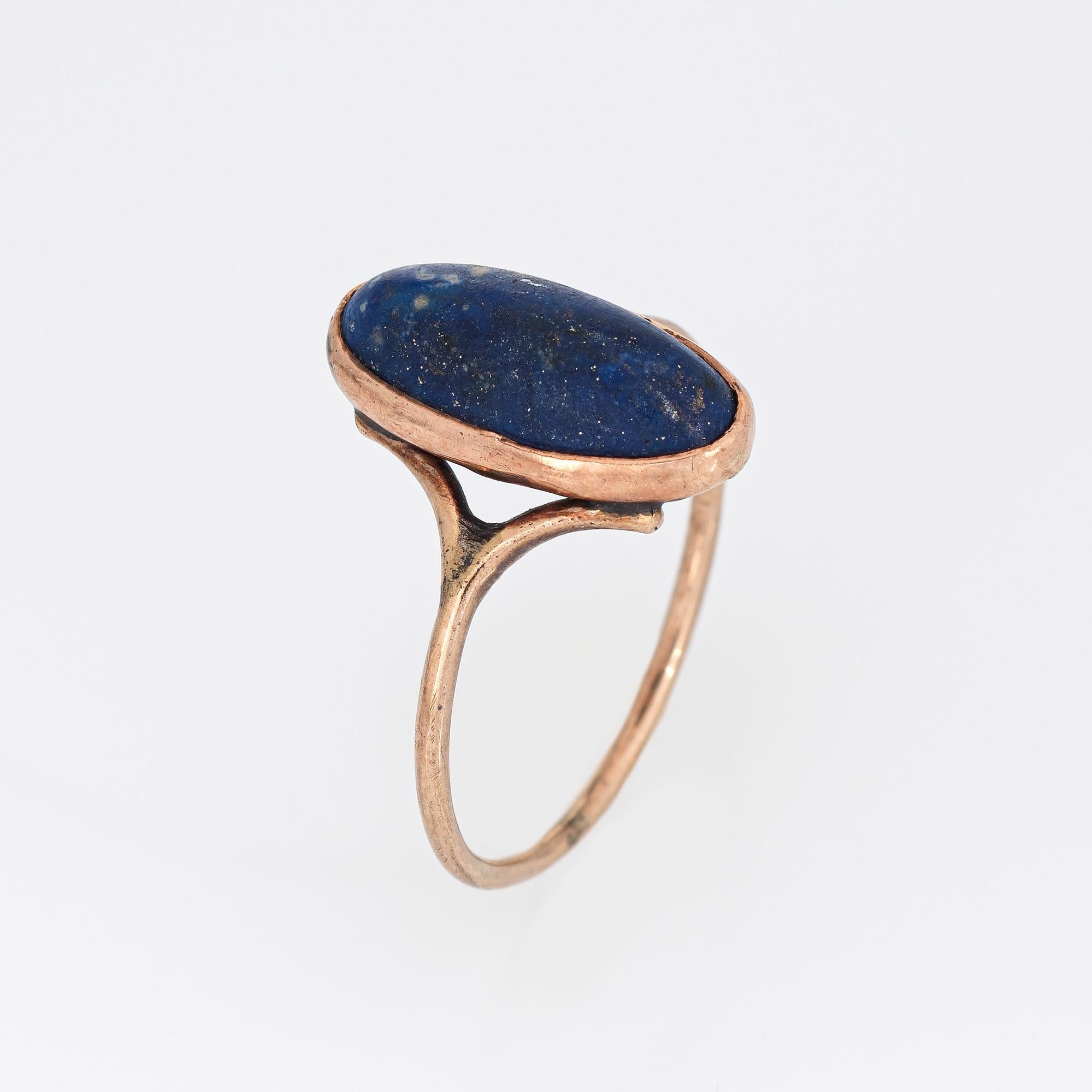 Finely detailed antique Victorian small oval lapis lazuli ring (circa 1880s to 1900s), crafted in 10 karat yellow gold. 

Lapis lazuli measures 12mm x 6mm. The lapis is in good condition and free of cracks or chips. Light surface abrasions evident