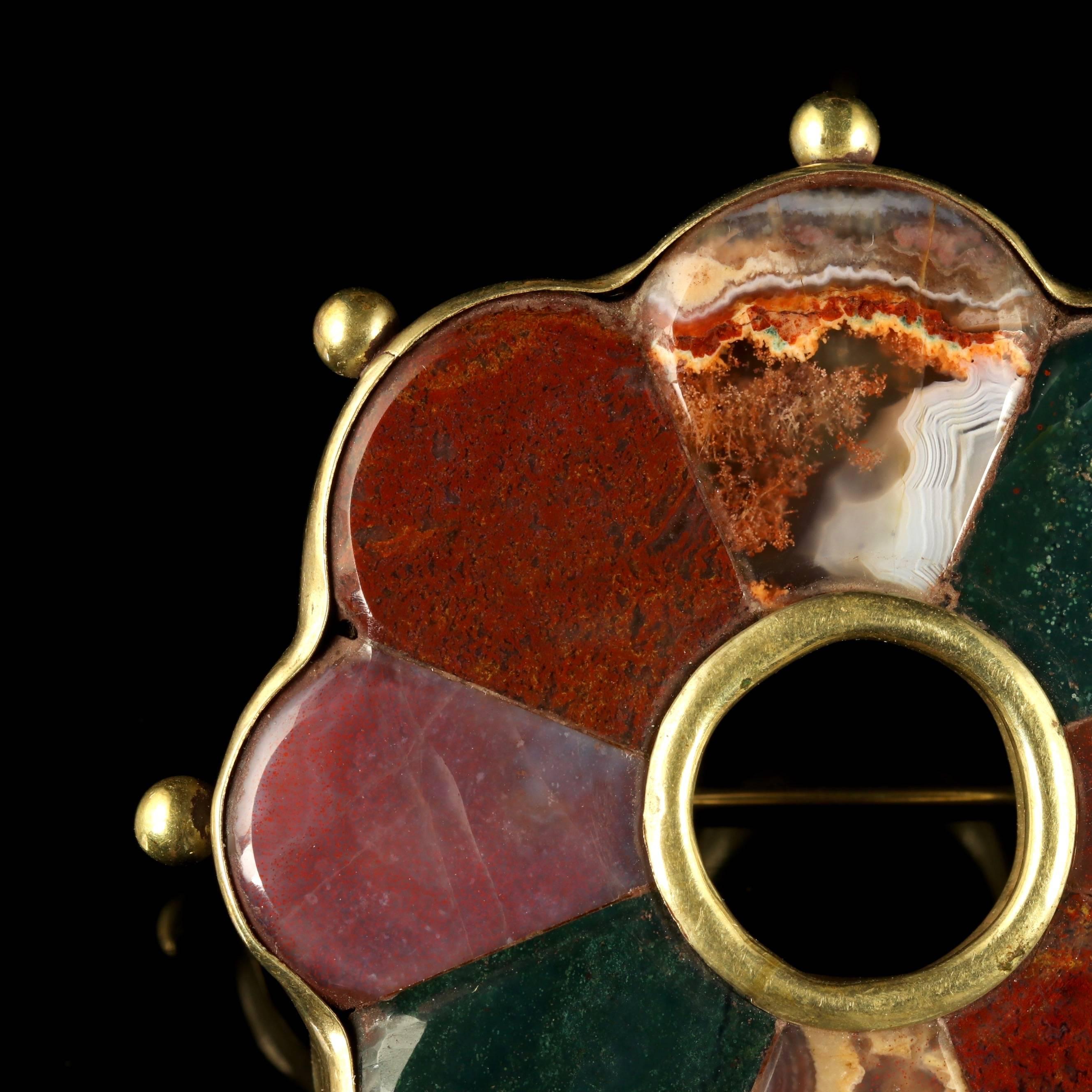 This beautiful Victorian Scottish Silver gilded on Gold brooch is adorned with fabulous Agates, Circa 1880.

Scottish jewellery was made popular by Queen Victoria as it became a souvenir of her frequent trips to Scotland and her Scottish Castle