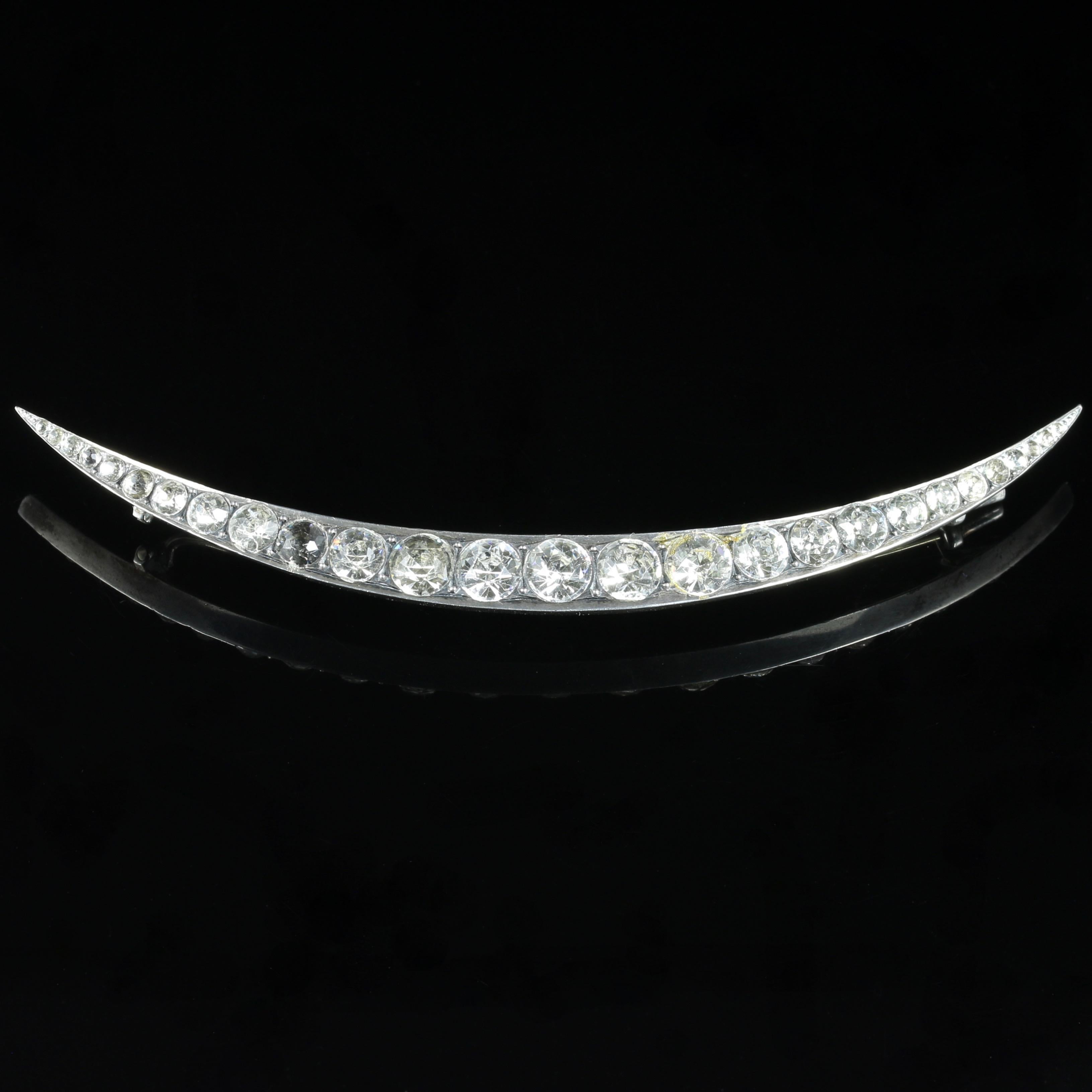 For more details please click continue reading down below...

This exquisite antique Victorian crescent brooch is adorned with old cut Paste Stones. Circa 1860

All set in Sterling Sliver.

27 fabulous old cut Paste Stones are set into this amazing
