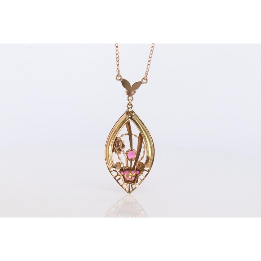 Vintage from the 1900s
Materials: Stone
Gemstone: Ruby

Style: Art nouveau

Large Early 1900s Century Lavaliere.

Made by White Manufacturing Co.

10k Yellow and Rose Gold.

Adorned with Rubies.

Details:
21mm by 38mm pendant
17in length
4.7grams