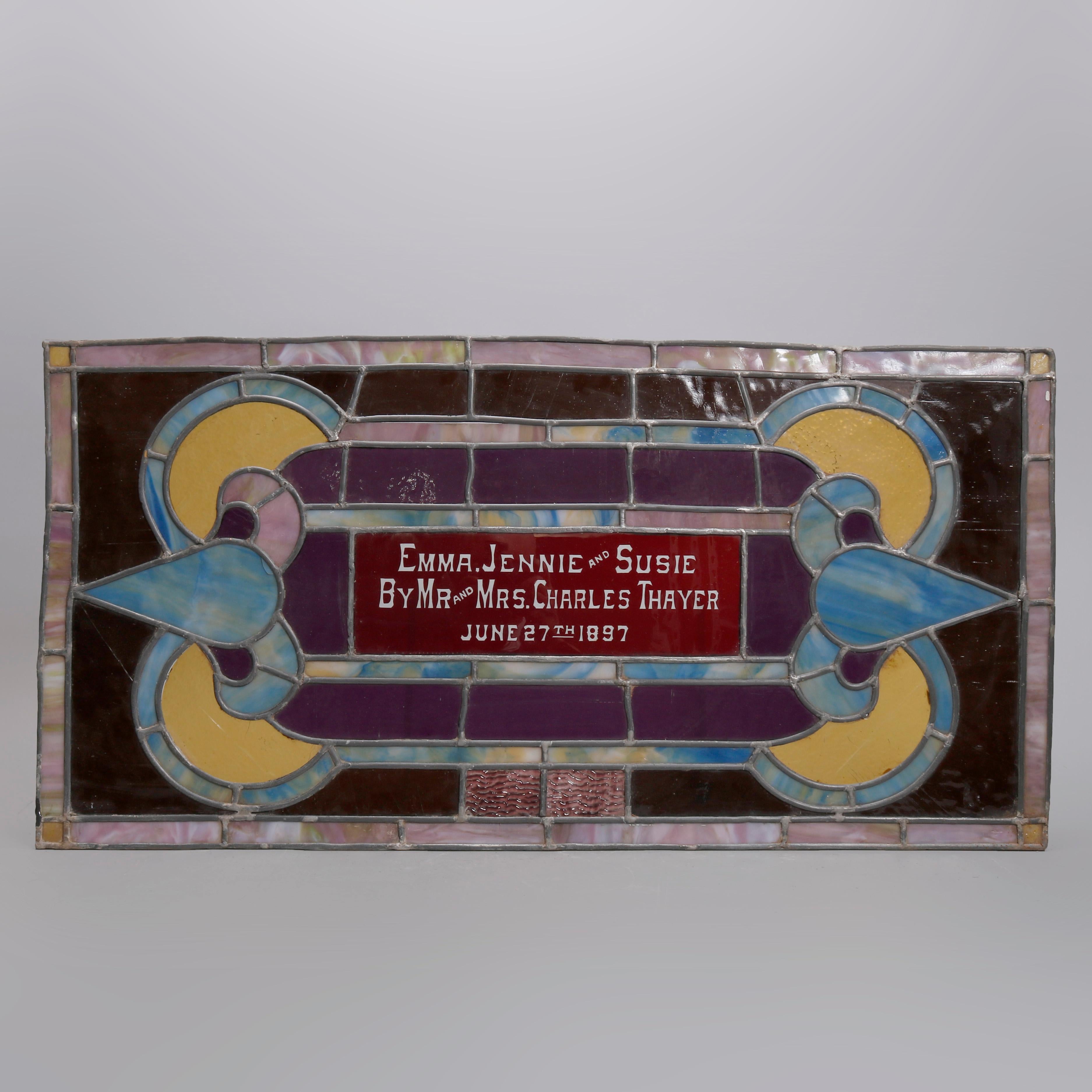 An Victorian leaded stained glass panel offers scroll design with central pane with 