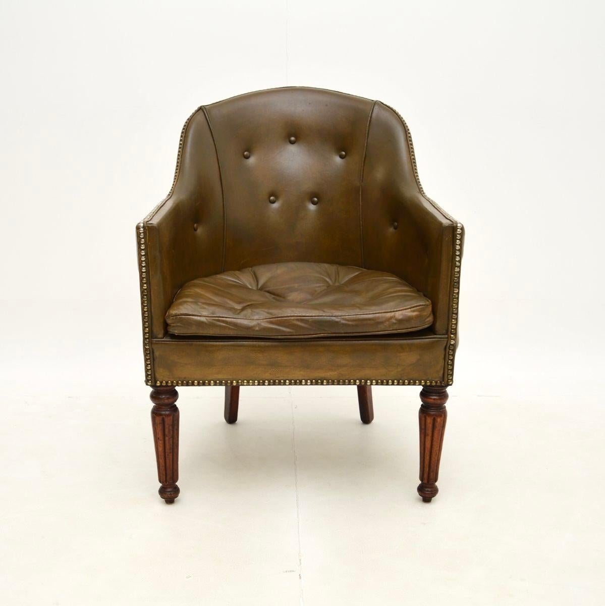 A smart and extremely well made early antique Victorian leather armchair. This was made in England, it dates from around the 1840-1850 period.

It is of very fine quality, it is extremely comfortable and it is a useful size. Perfect for use as a