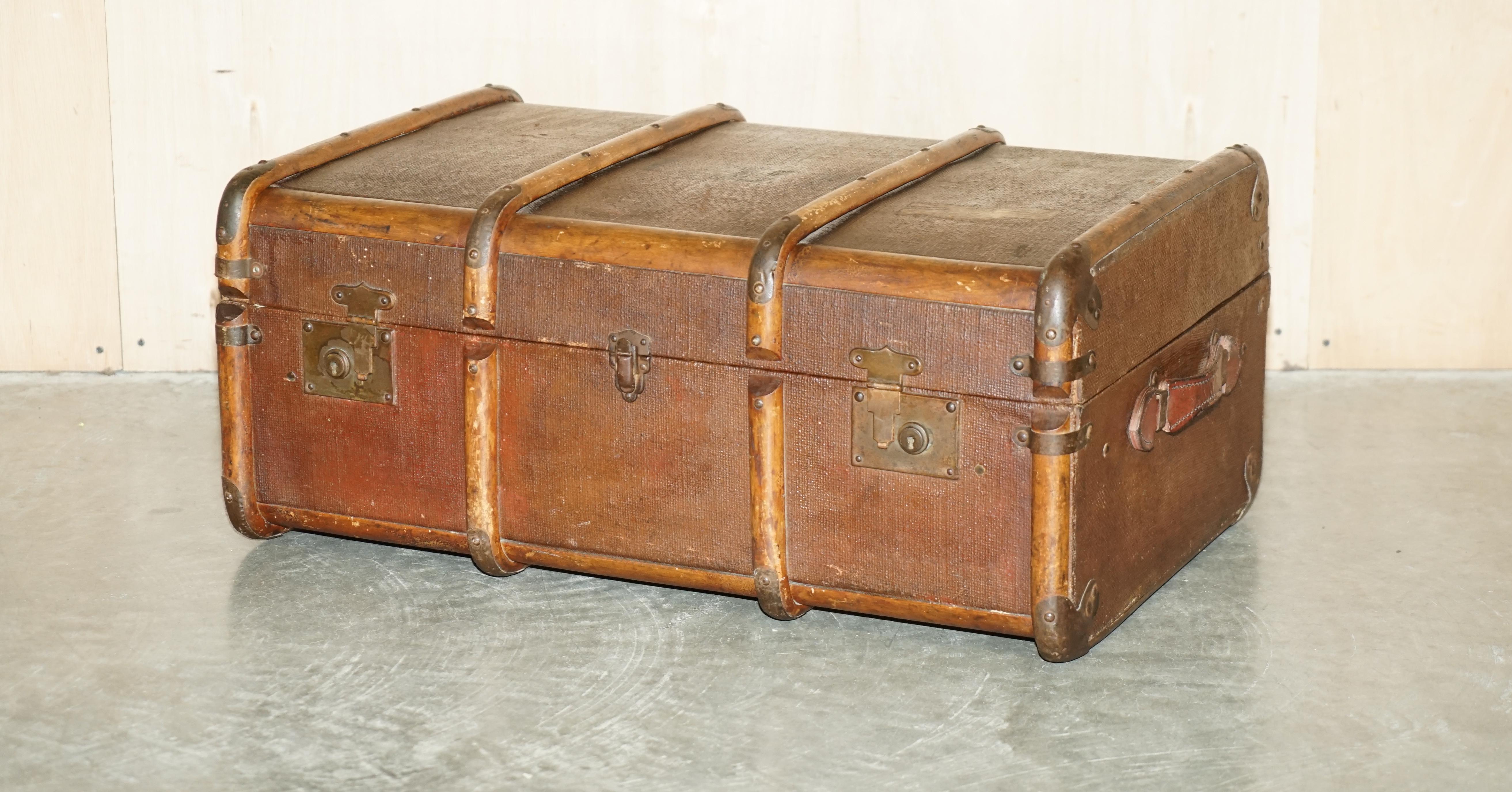 We are delighted to offer for sale this original circa 1880 English Elm strapped with Wrought Iron rivets, leather handled, canvas steamer trunk 

This is a very well made example of a steamer trunk designed for luxury travel on cruise liner
