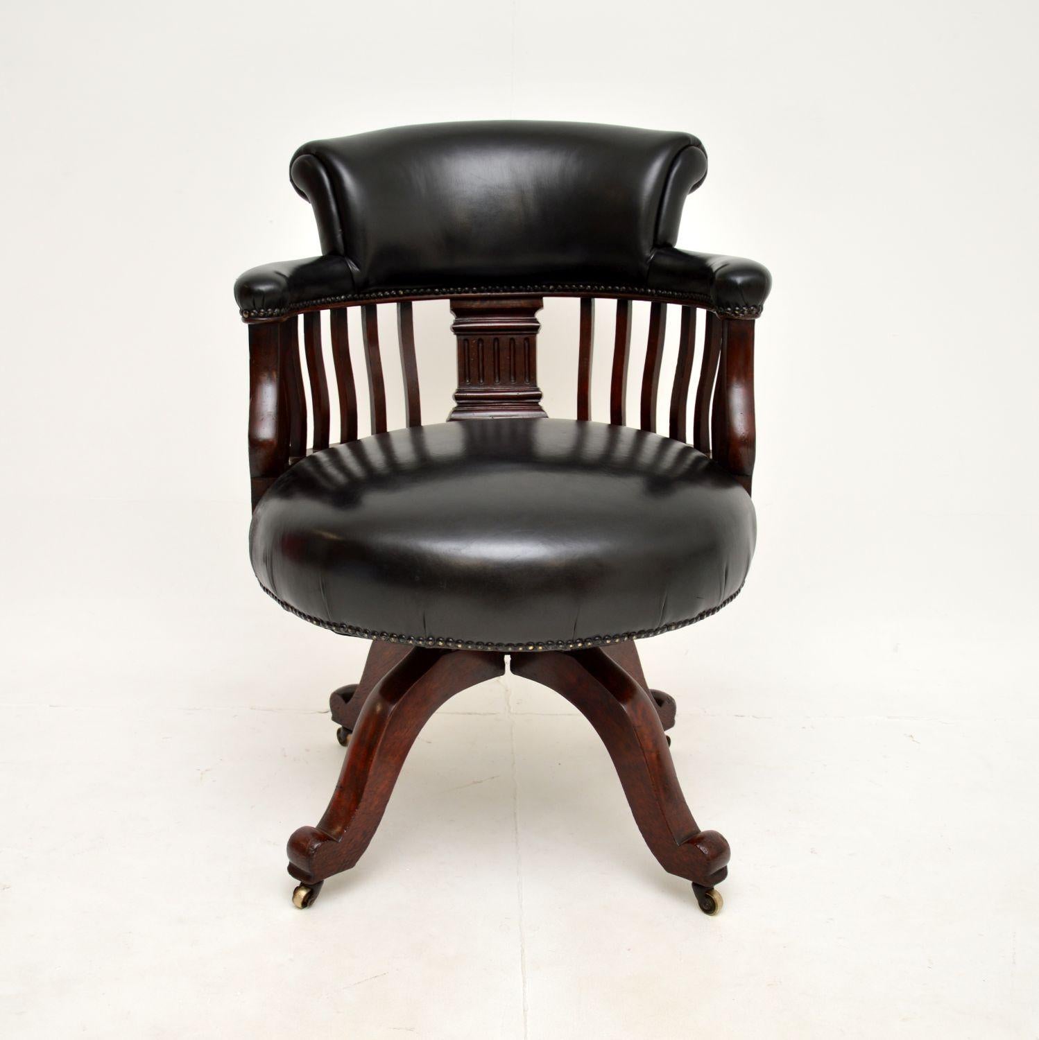 A superb antique Victorian leather swivel desk chair. This was made in England, it dates from around the 1870-1890 period.

The quality is outstanding, this is a great size and is very comfortable. The frame is dark stained solid oak, which is