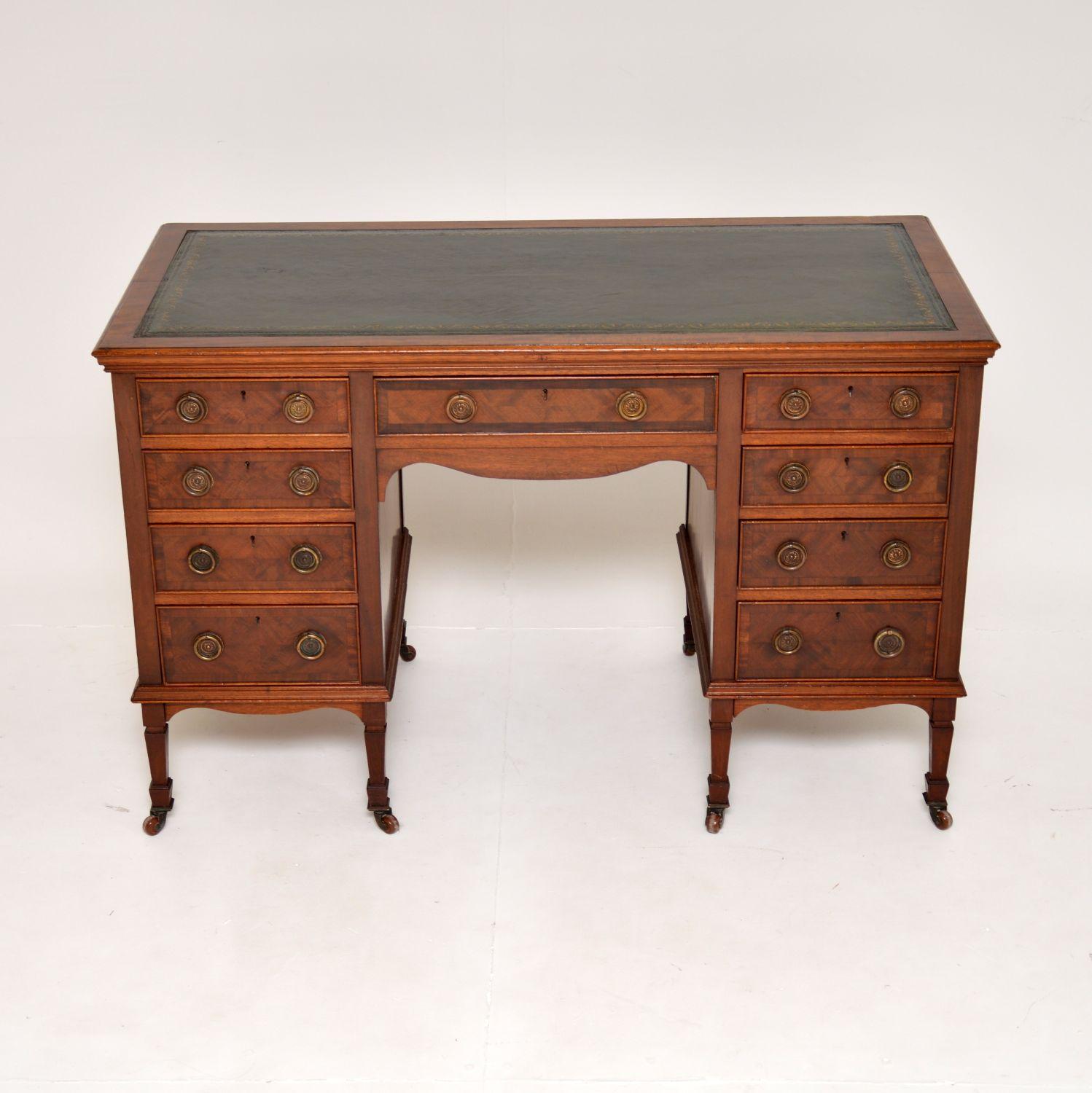 A fantastic original antique Victorian leather top desk. This was made in England, it dates from around 1880-1900.

The quality is amazing, this is very sturdy and well built. There is lots of storage space inside the nine generous drawers. The