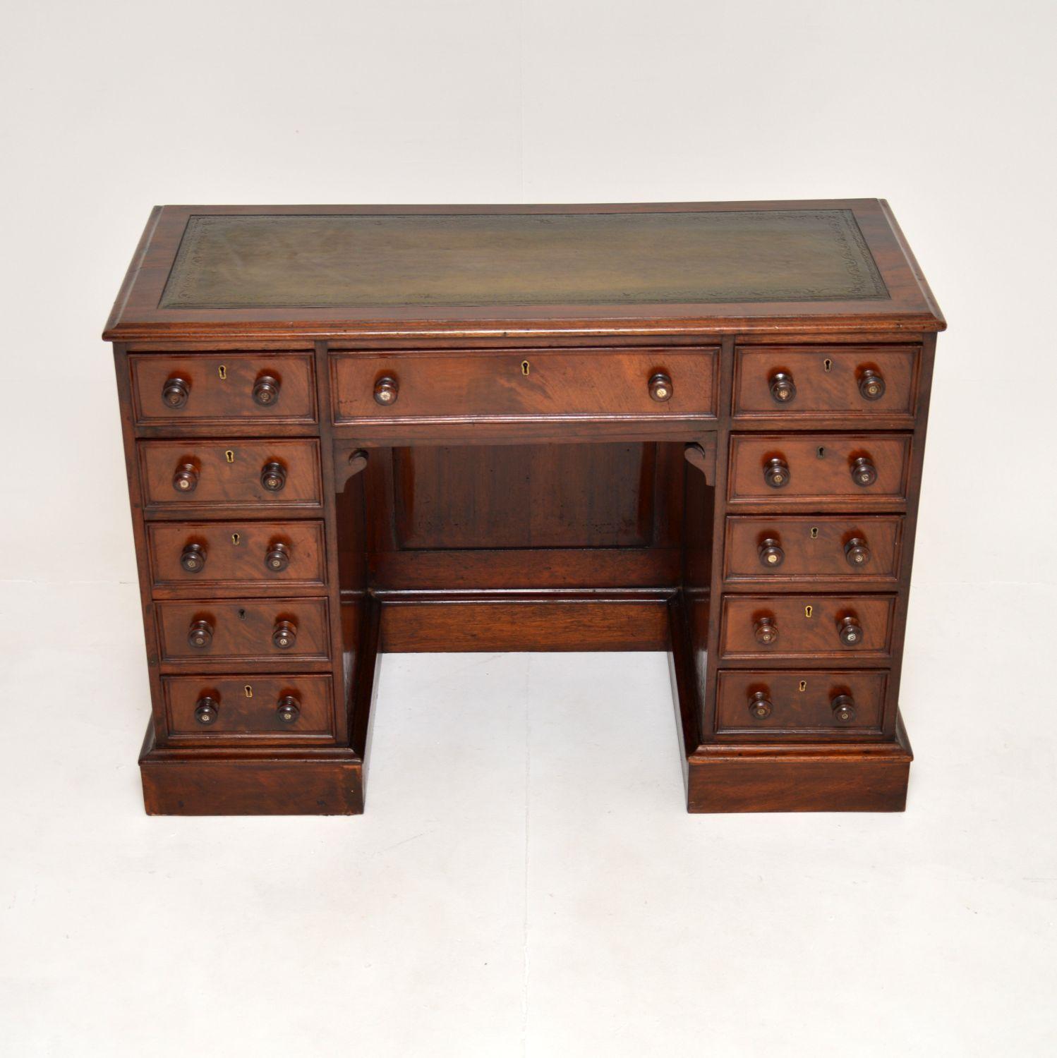 A wonderful antique Victorian leather top knee hole desk. This was made in England, it dates from around 1860-1880.

It is of superb quality and is a lovely size. This is all one piece with a built in knee hole giving rise to the term ‘knee hole’