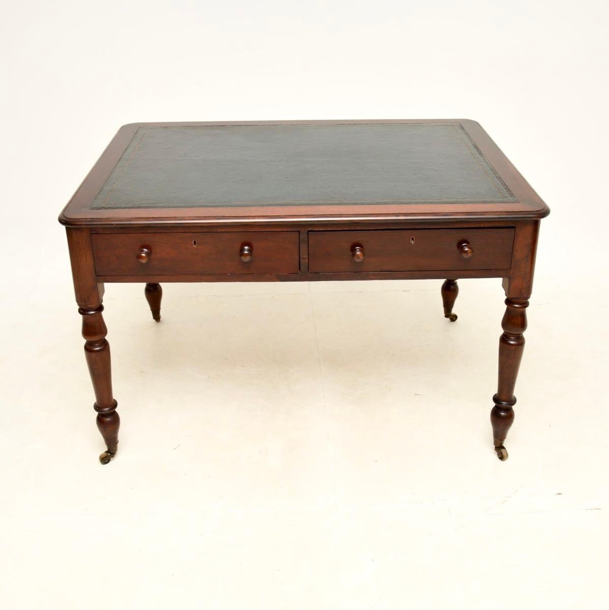 A superb antique Victorian leather top partners desk / writing table. This was made in England, it dates from around the 1860-1880 period.

It is of great quality and is an impressive size with plenty of work space. The top is inset leather with
