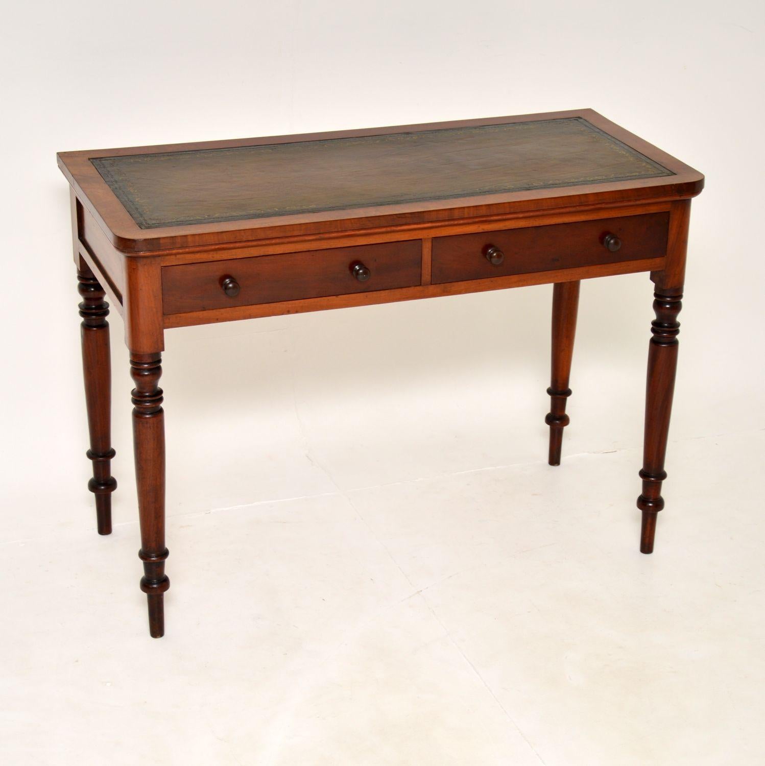 An excellent antique early Victorian writing table, made in England & dating from around the 1840-1860’s period.

It is a great size and is extremely well made. The inset leather top has been hand coloured and gold tooled. There are panelled