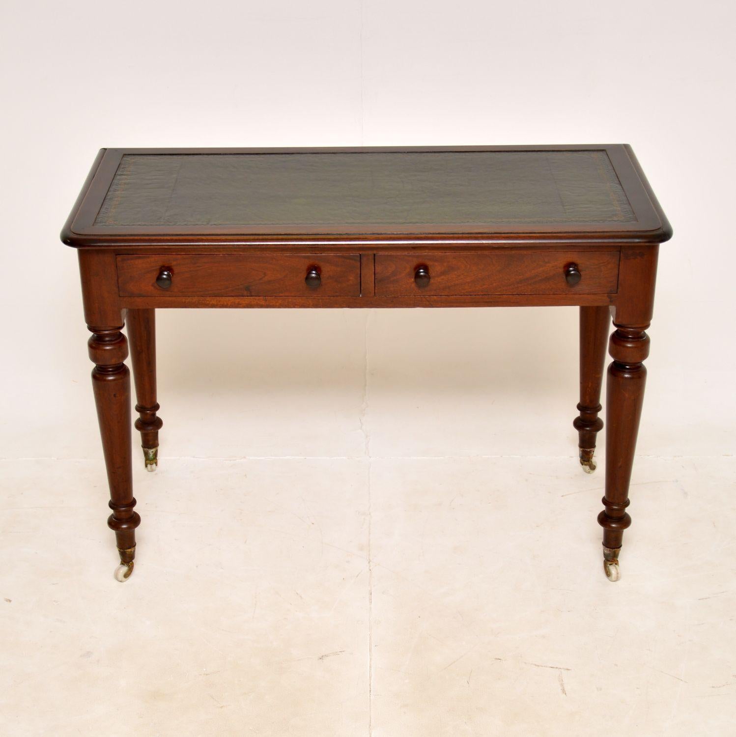 A very smart and useful antique Victorian writing table / desk. This was made in England, it dates from around the 1860-1880 period.

It is a very practical size and is of amazing quality. The beautifully turned legs sit on porcelain casters, the