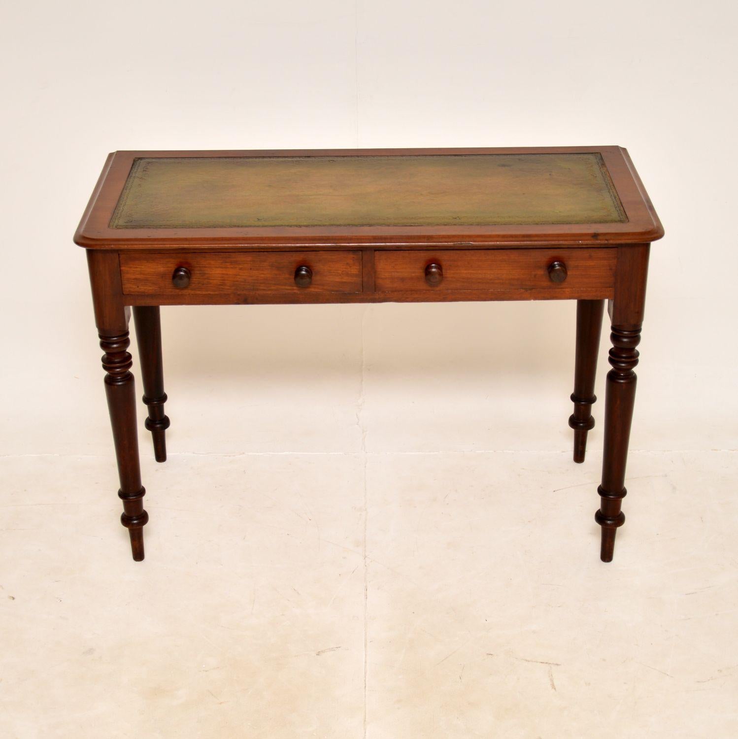 A smart and very useful antique Victorian writing desk. This was made in England, it dates from around the 1860-1880 period.

It is very well made and is a very useful size, not too deep from front to back. The inset leather writing surface is