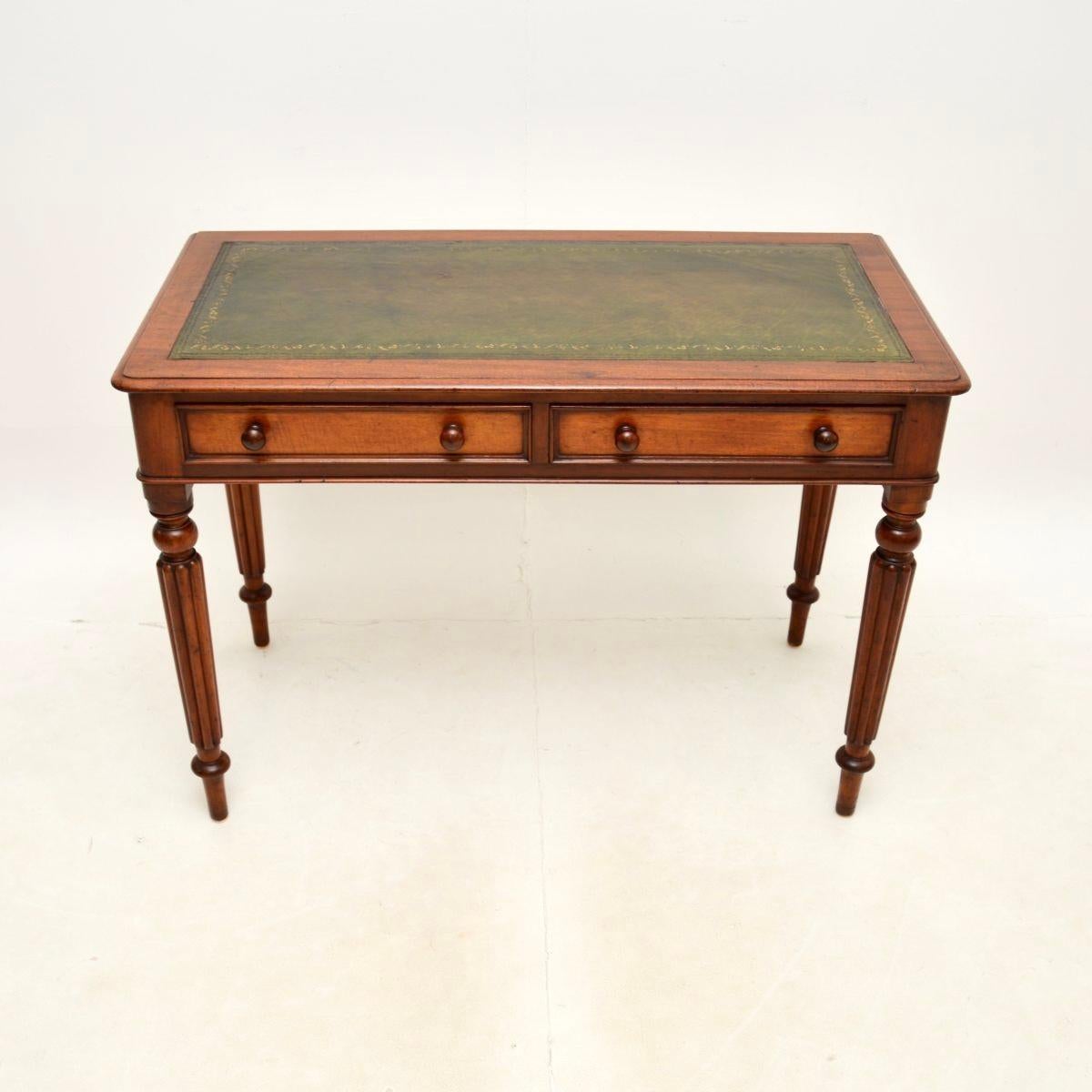 A charming antique Victorian leather top writing table / desk. This was made in England, it dates from around the 1860-1880 period.

It is very well made and is a lovely size. It sits on turned solid turned and fluted legs, the drawers have
