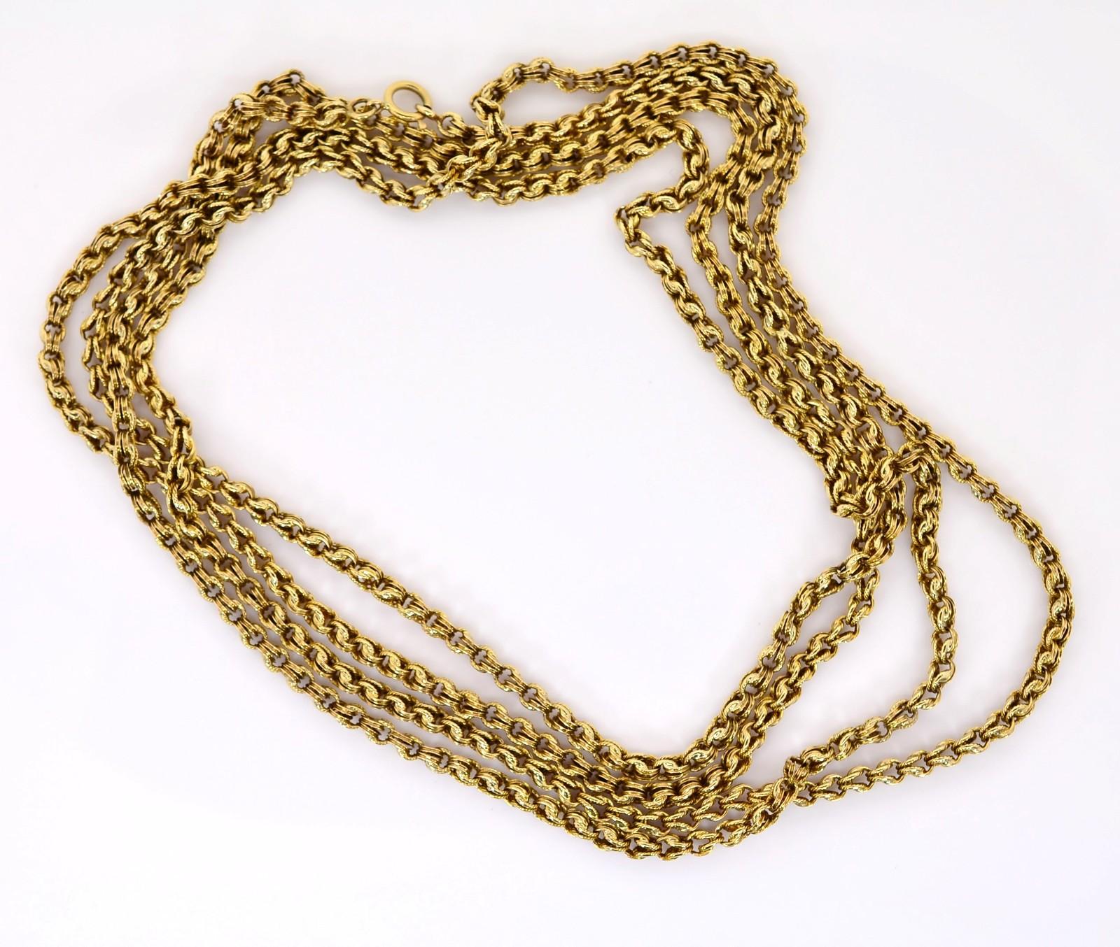 This classic double loop link Victorian chain was created in 14KT yellow gold.   Due to his long length of 55 inches it has the versatility to be worn twice or layered three times around or it could very well be worn around the wrist as a soft