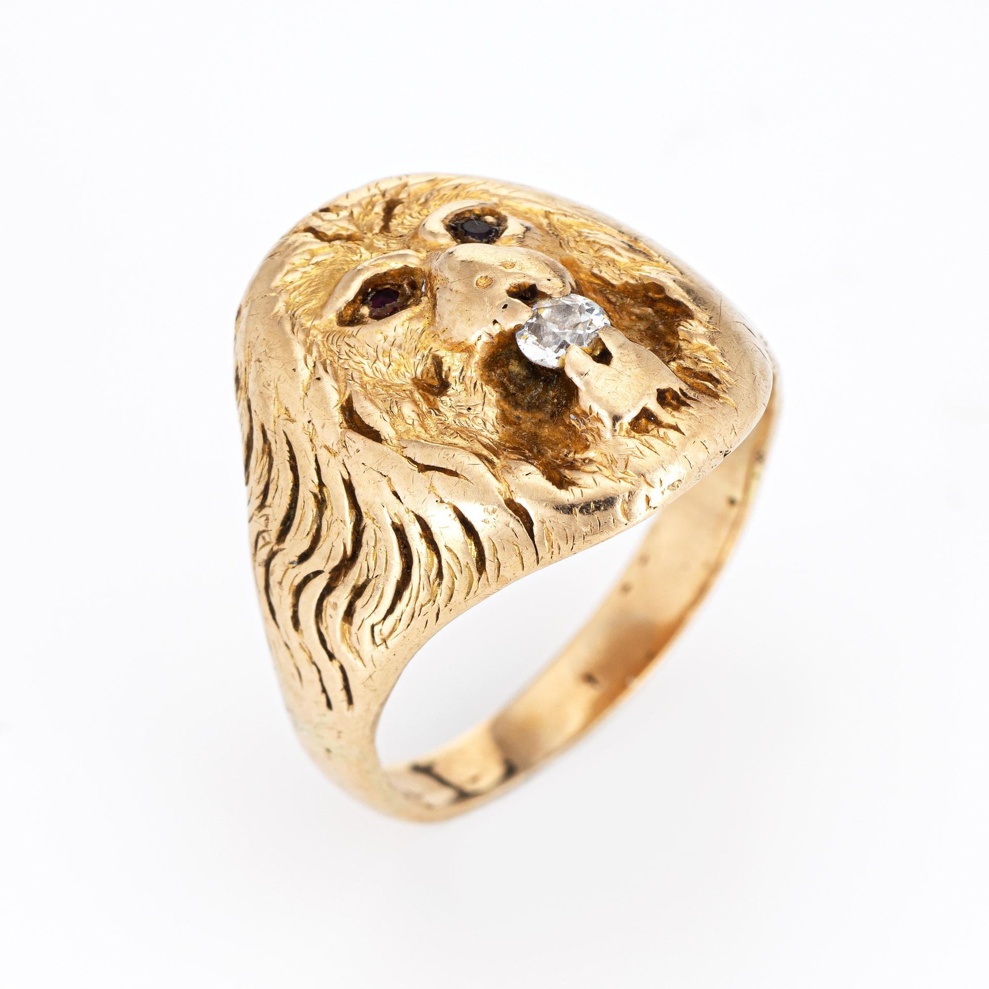 Elegant antique Victorian Lion ring (circa 1880s to 1900s), crafted in 14 karat yellow gold. 

Old mine cut diamond is estimated at 0.10 carats (estimated at H-I color and SI2 clarity. The 
garnets total an estimated 0.02 carats).
The Lion features