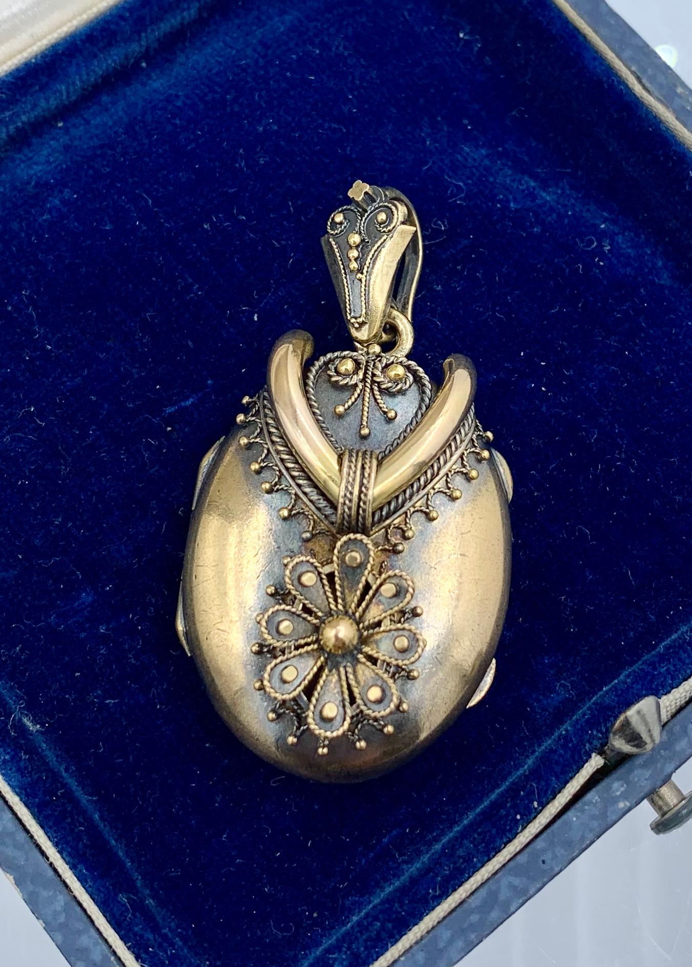This is a gorgeous 14 Karat Gold Victorian - Belle Epoque Picture Locket pendant in an Etruscan Revival Design of great beauty.  The locket has the most stunning warm brushed 14 Karat Gold work with fantastic raised beaded cannetille designs with