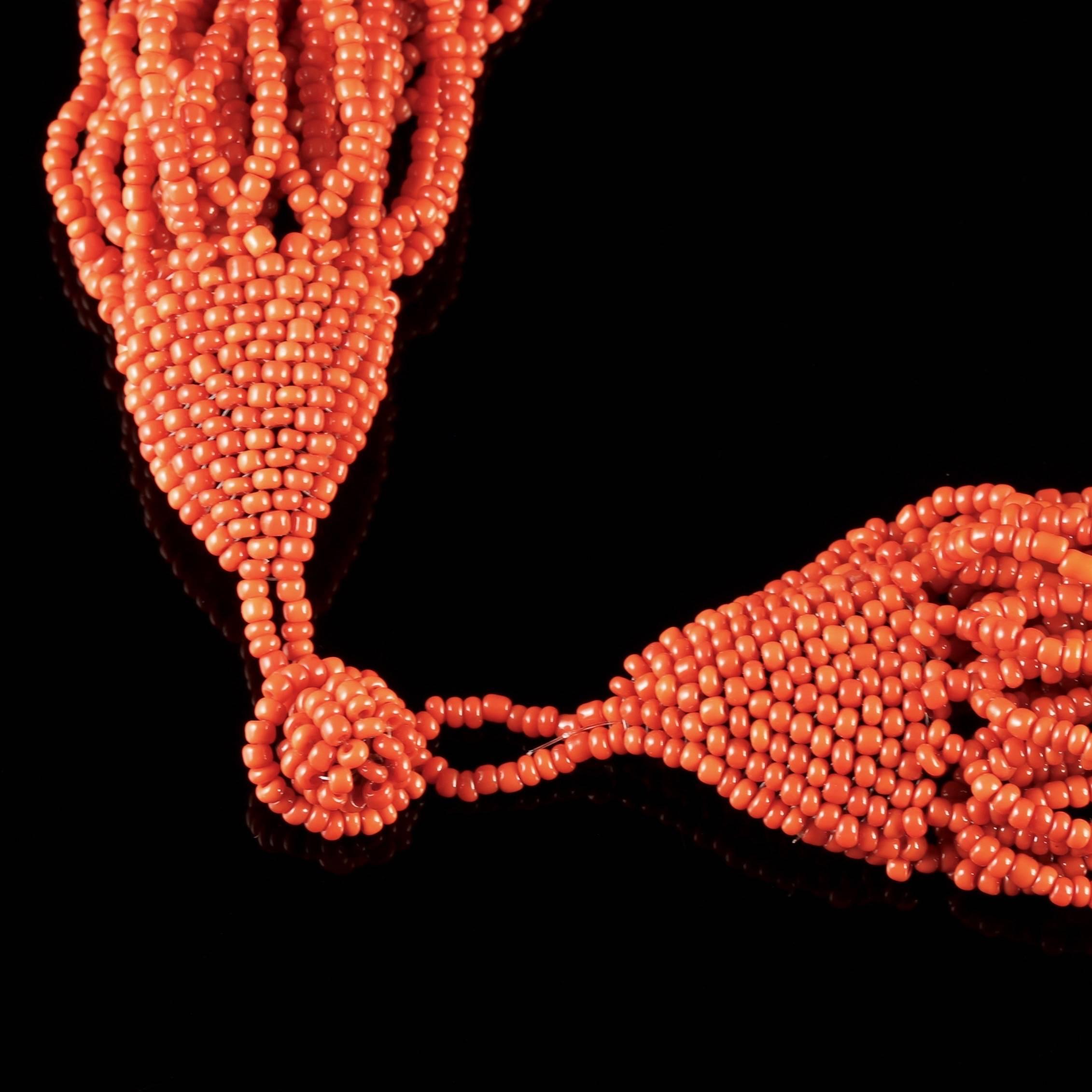 To read more please click continue reading below-

This magnificent antique Victorian long multi-strand Coral Necklace is Circa 1900. 

The spectacular necklace displays 32 strands adorned with fabulous Coral beads which cascade down the entire