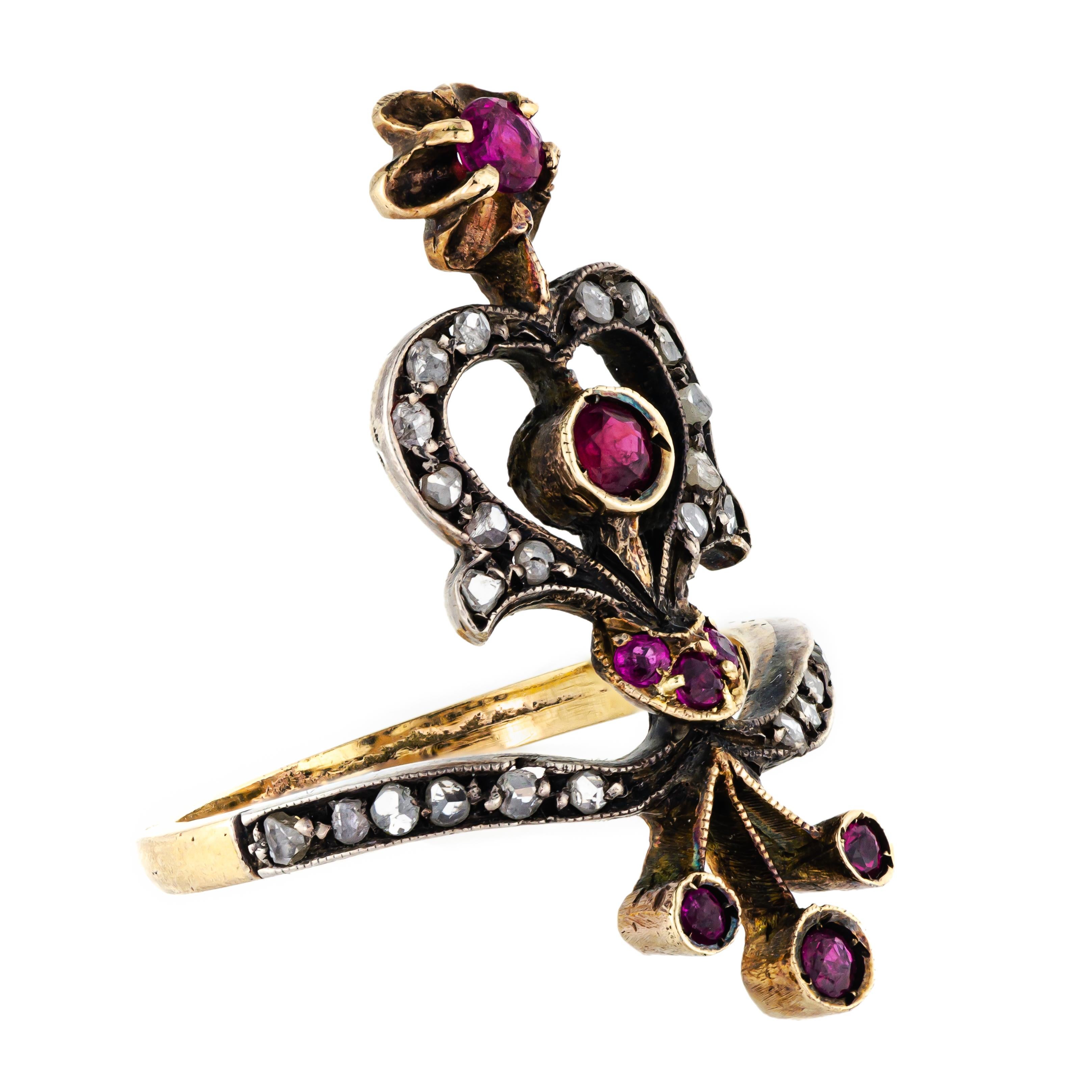Victorian long ring of a floral spray design silver-topped yellow gold set with rose-cut diamonds and round rubies. Currently, a size 7 3/4 but can be sized