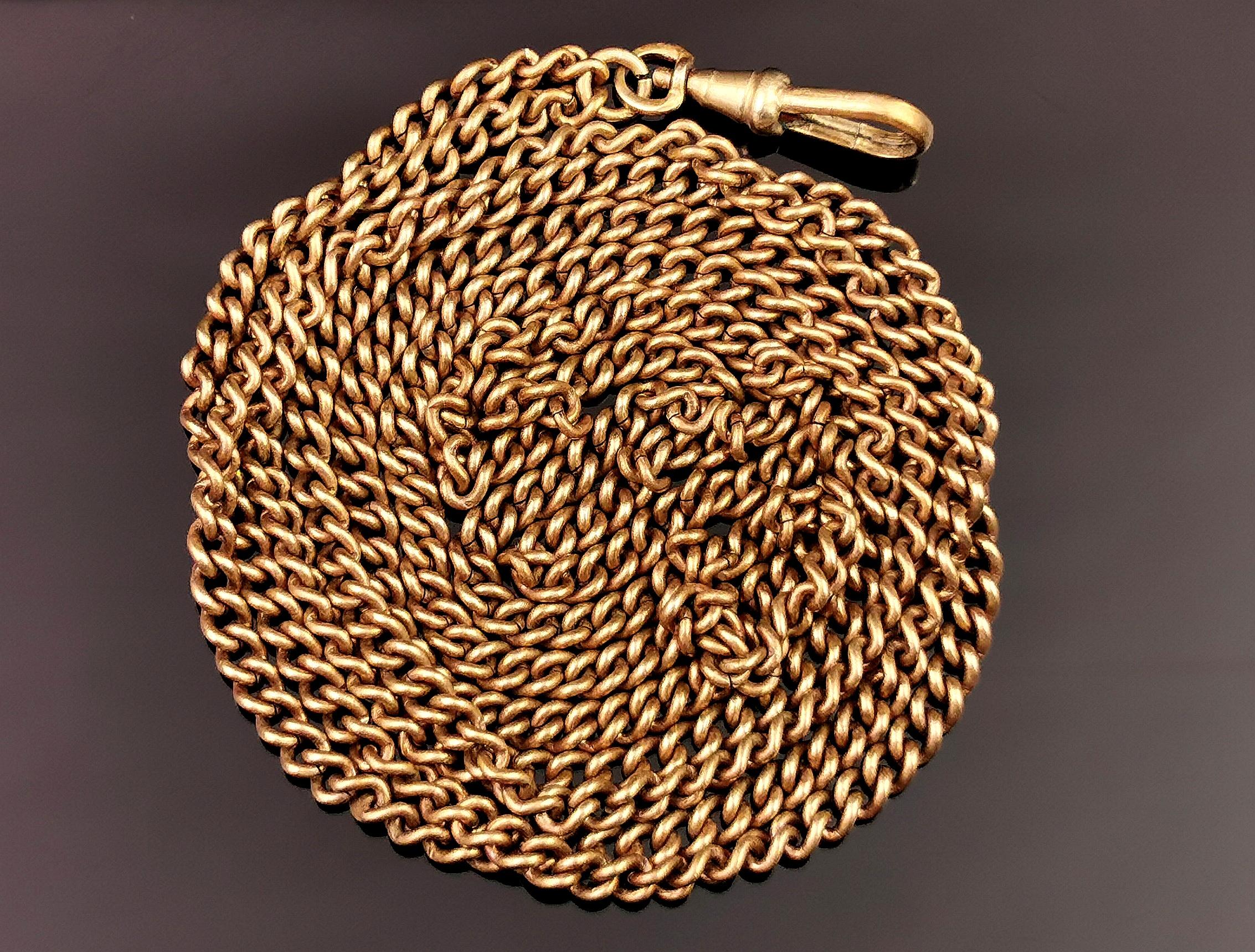 A gorgeous antique, Victorian era longuard chain necklace.

This is quite a chunky curb link long chain, gold plated brass though most of the plating is worn and lots of warm bronze brass colours showing through.

It has a dog clip fastener to one