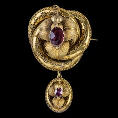 Antique Victorian Lovers Knot Brooch Amethyst 15 Carat Gold Locket, circa 1880