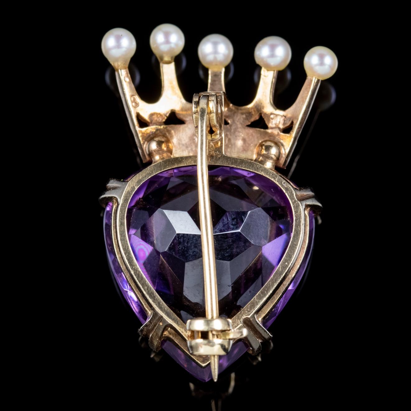 A beautiful antique Victorian Luckenbooth brooch featuring an impressive 20ct Amethyst cut in the shape of a heart with a golden crown on top decorated with Pearls. A Luckenbooth is a traditional Scottish love token often given as a wedding gift and