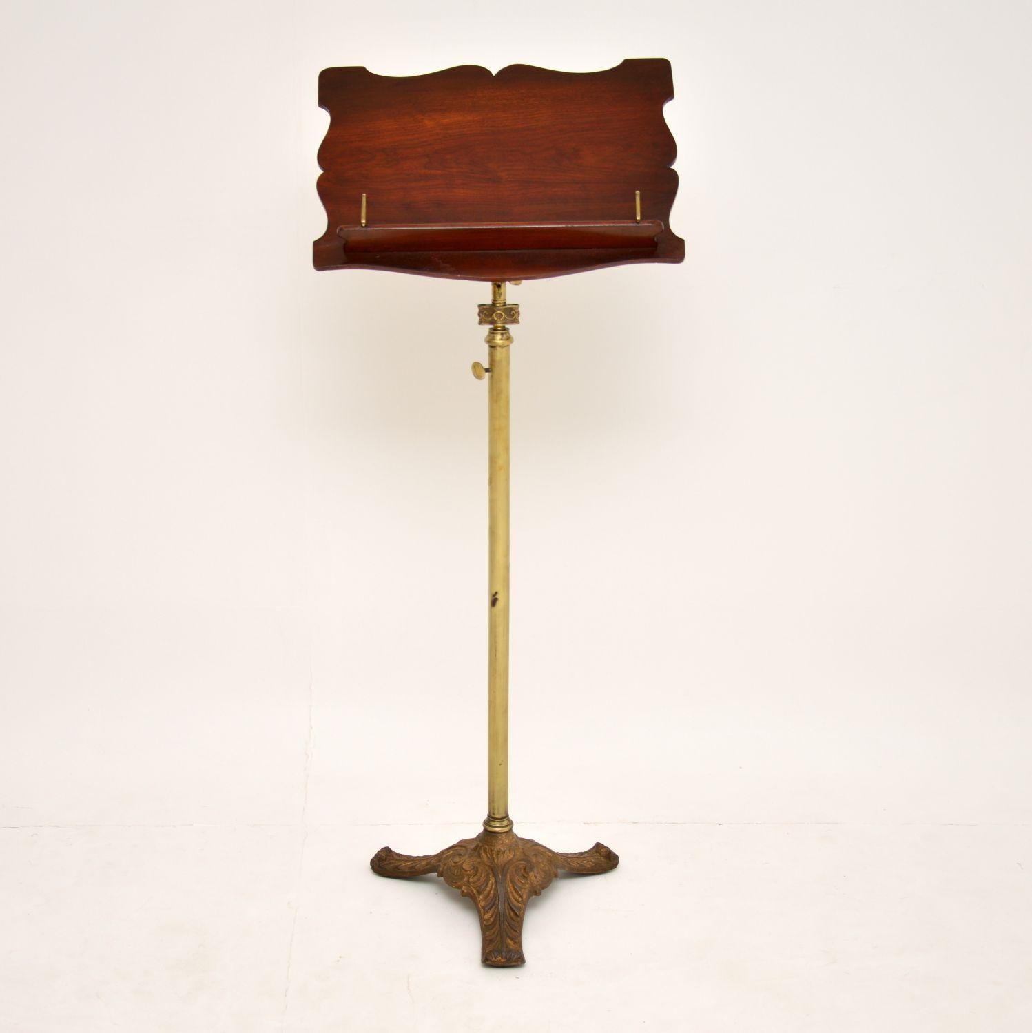 Antique Victorian mahogany & brass reading or music stand, in good condition & dating to around the 1860’s period.

The top section is mahogany & is adjustable. The upright brass stand also has a height adjustment system. The heavy base section is