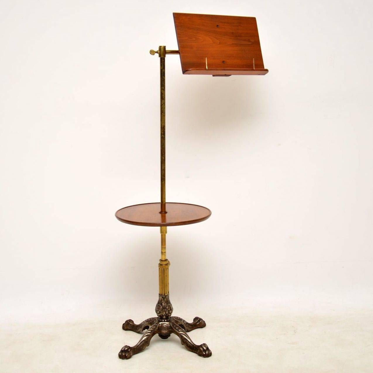 This antique Victorian reading table stand was made by the top Victorian makers John Carter. See the lovely label on the back. Each section is fully adjustable and there is a tilt facility for the top reading section. The metal is very decorative