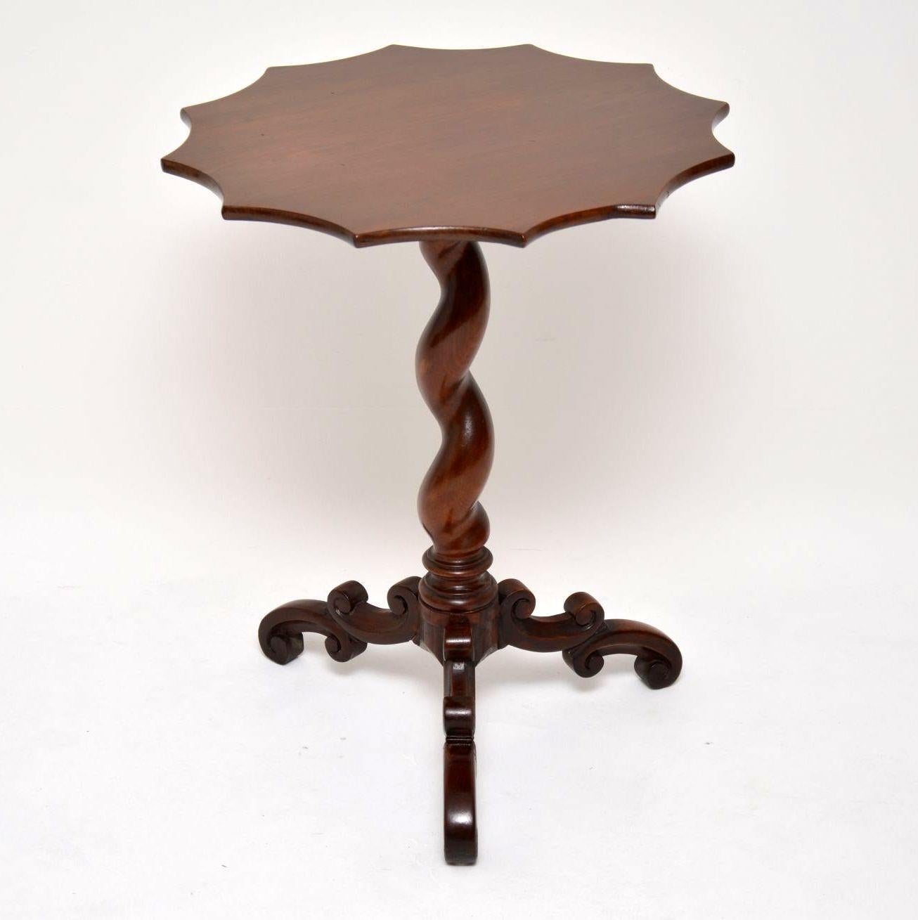 This solid mahogany occasional table is from the William IV – 1830-1840 period and is in excellent original condition. It also has some lovely features, like the twelve cut out sides on the top, the think barley twist pedestal and the shaped out
