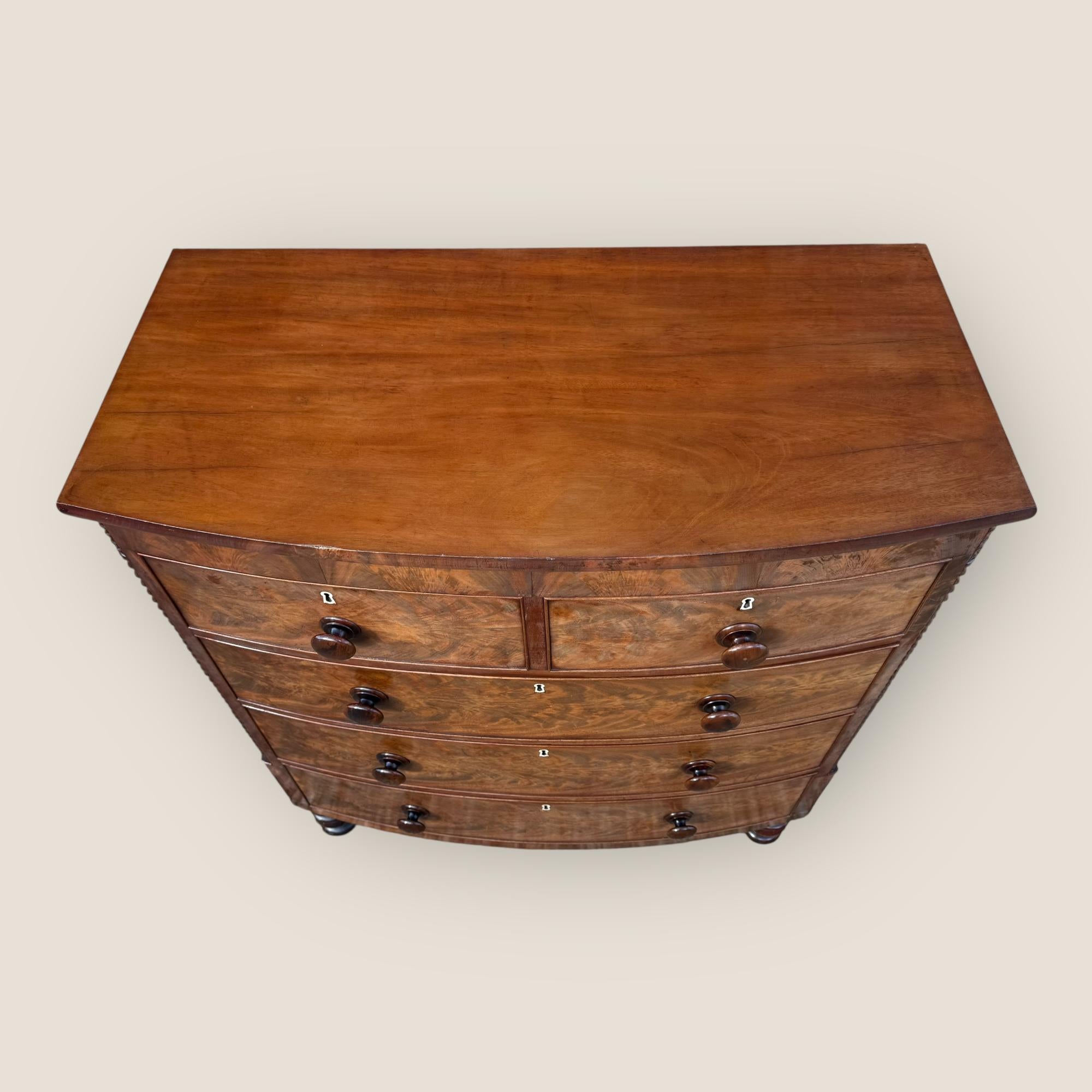 Ivory Antique Victorian Mahogany Bow Front Chest of Drawers with Wooden Handles For Sale