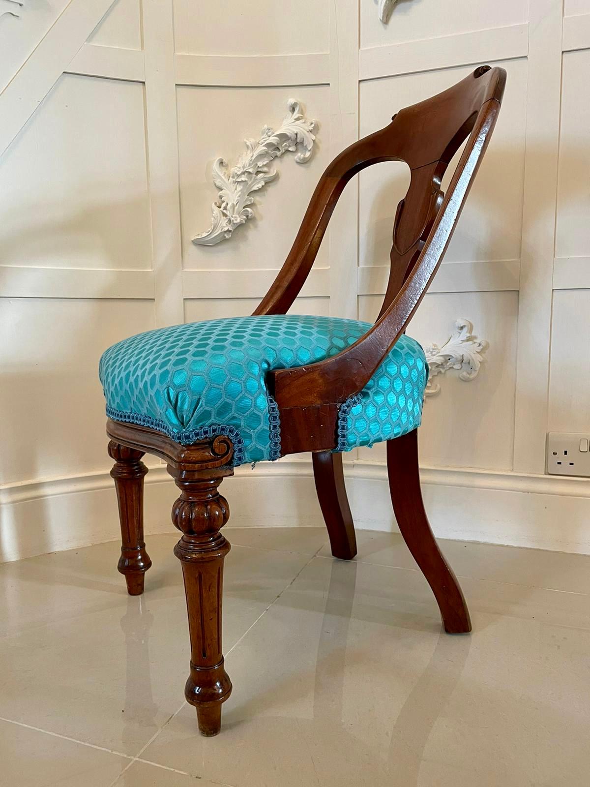 Quality antique Victorian mahogany carved nursing or dressing table chair having a beautiful shaped rounded back with an attractive carved top rail and centre splat. The seat is newly re-upholstered in a quality fabric. It is raised on elegant