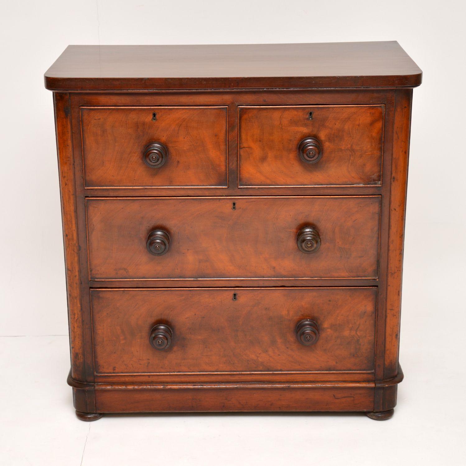 Small antique Victorian mahogany chest of drawers in good condition and with lots of character. It has rounded corners and deep drawers with turned mahogany handles, locks & Fine dovetails. One particular nice feature is the bottom drawer that’s
