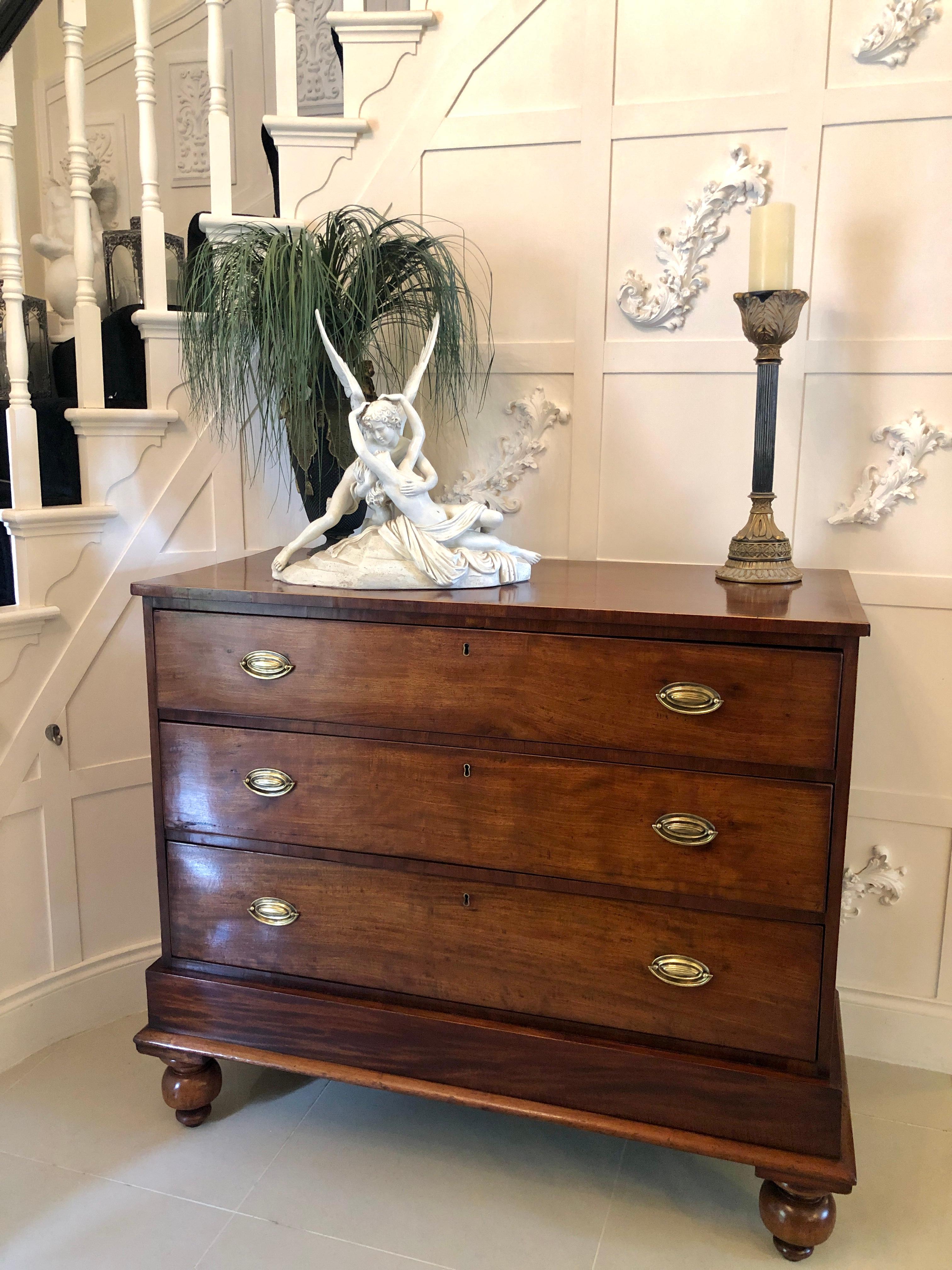 Antique mahogany Victorian chest of drawers having a quality mahogany top with boxwood stringing, solid mahogany sides and three long drawers with pretty brass handles. It stands on a moulded plinth and raised on original turned feet.

Measures: H