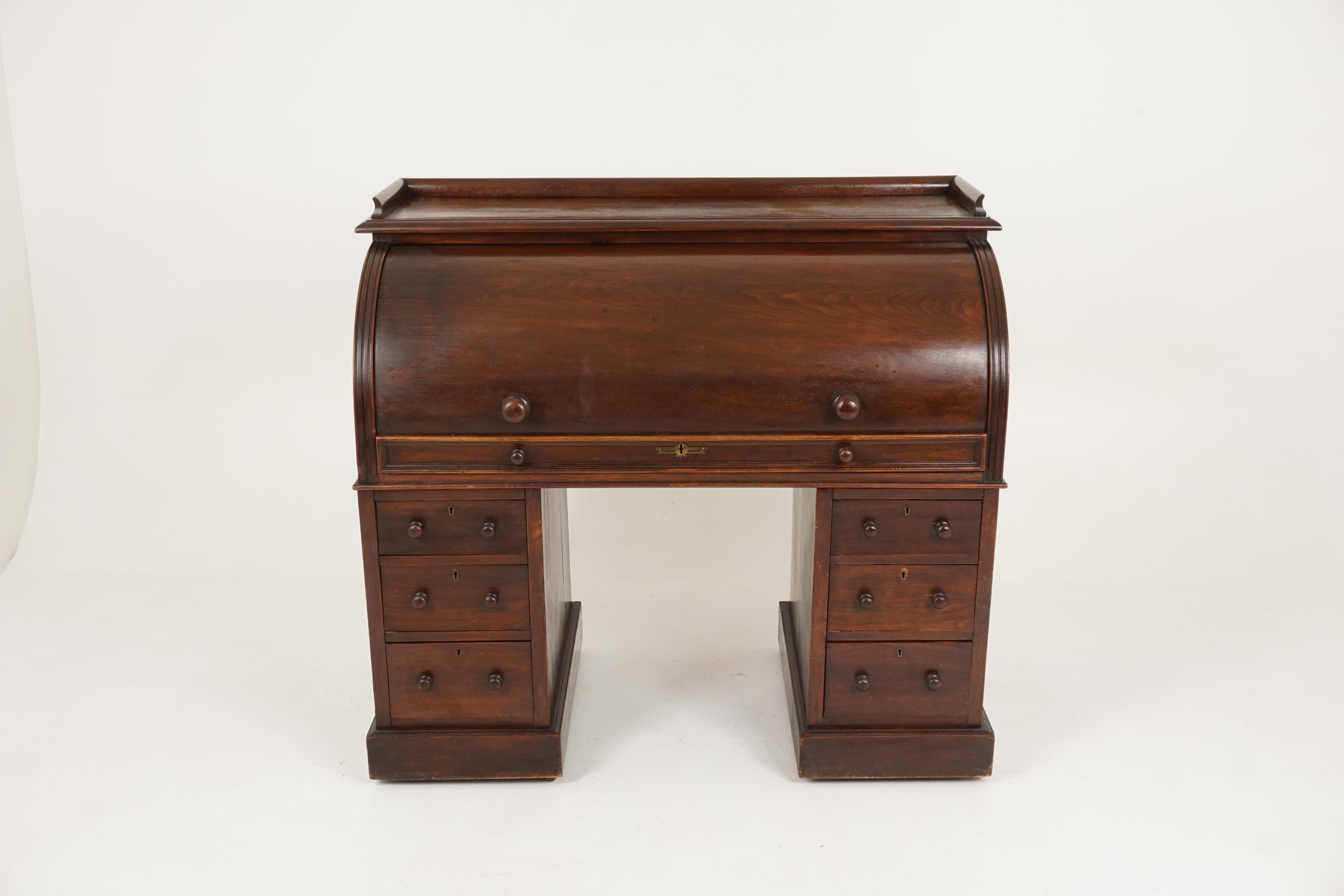 Antique Victorian mahogany desk, roll top desk, cylinder desk, Scotland 1880, B2183

Scotland, 1880
Solid mahogany and veneers
Original finish
Three quarter gallery with moulded edge
Above a cylinder top opening a configuration of pigeon hole