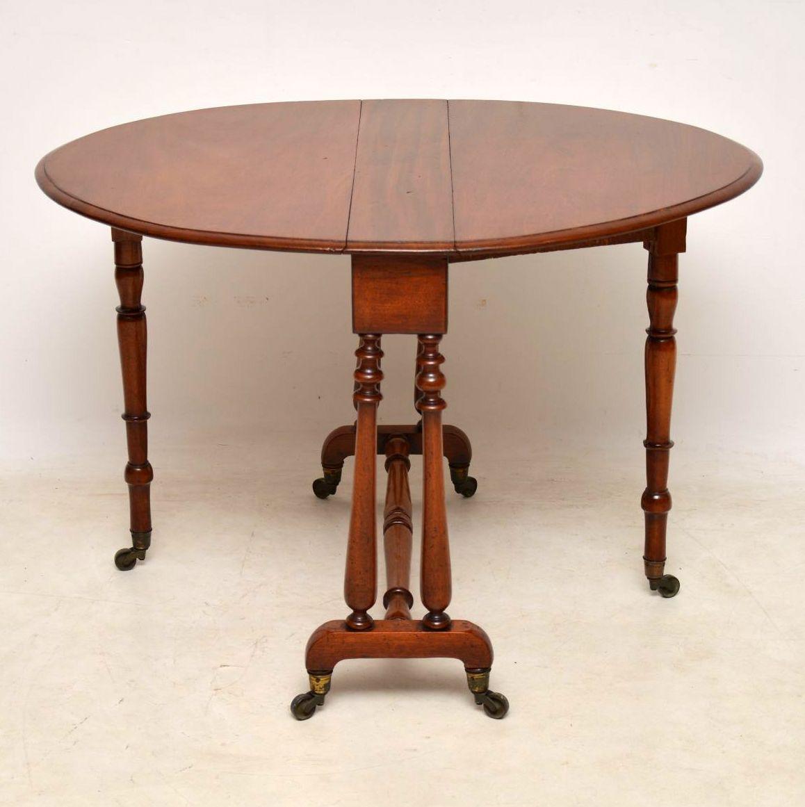 These Sutherland tables are very useful items, because they are so slim when folded up, so will store away easily. This one is solid mahogany and antique early Victorian. It’s in excellent original condition, with a nice warm color, good patina,