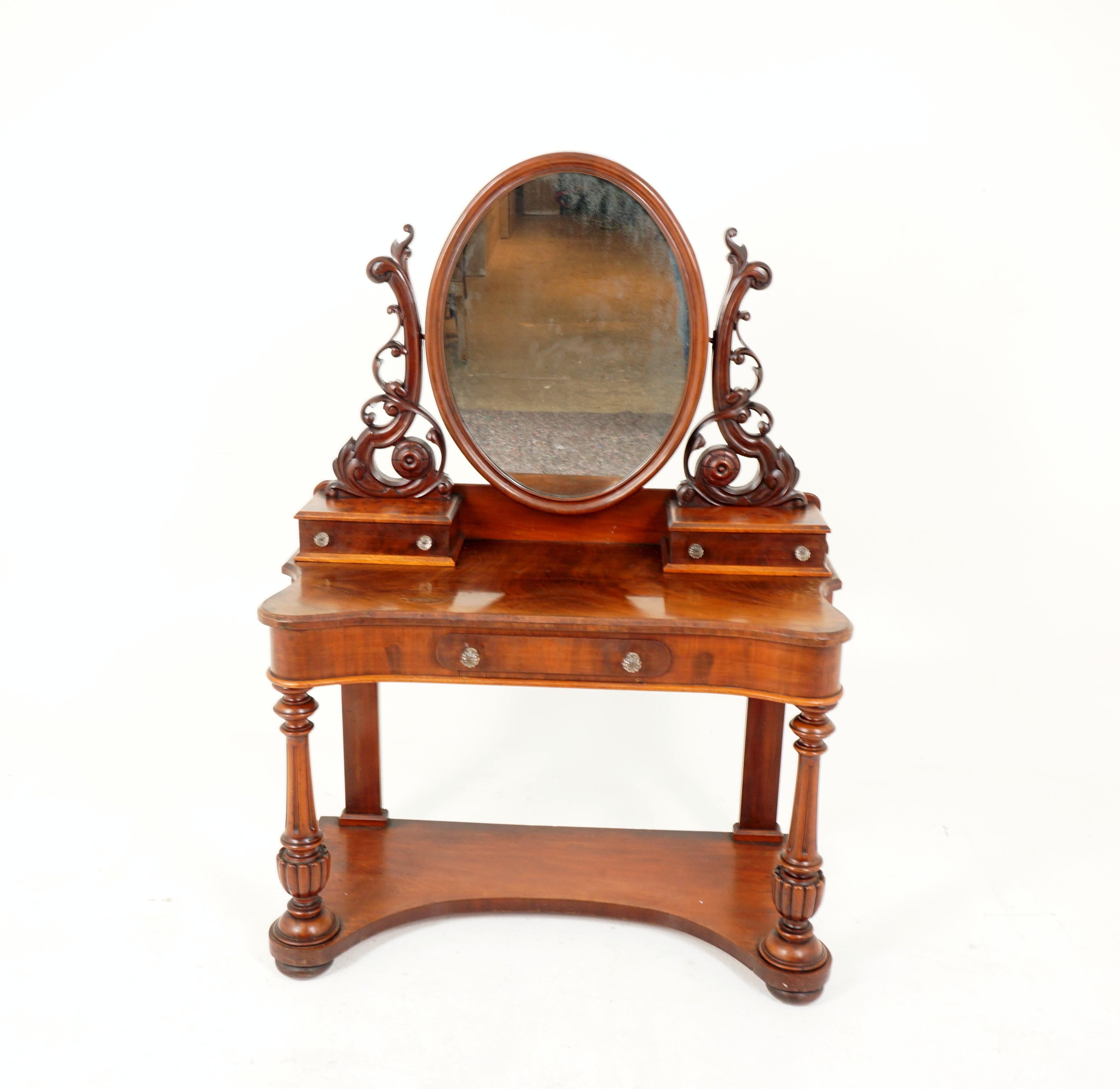 Antique Victorian mahogany duchess vanity dresser, Scotland 1870, H231

Scotland 1870
Solid mahogany 
Original finish
Oval mirror
Pair of jewelry drawer boxes on top 
Inverted top
With undershelf 
With turned legs to the front 

Measures: 43 x 20 x