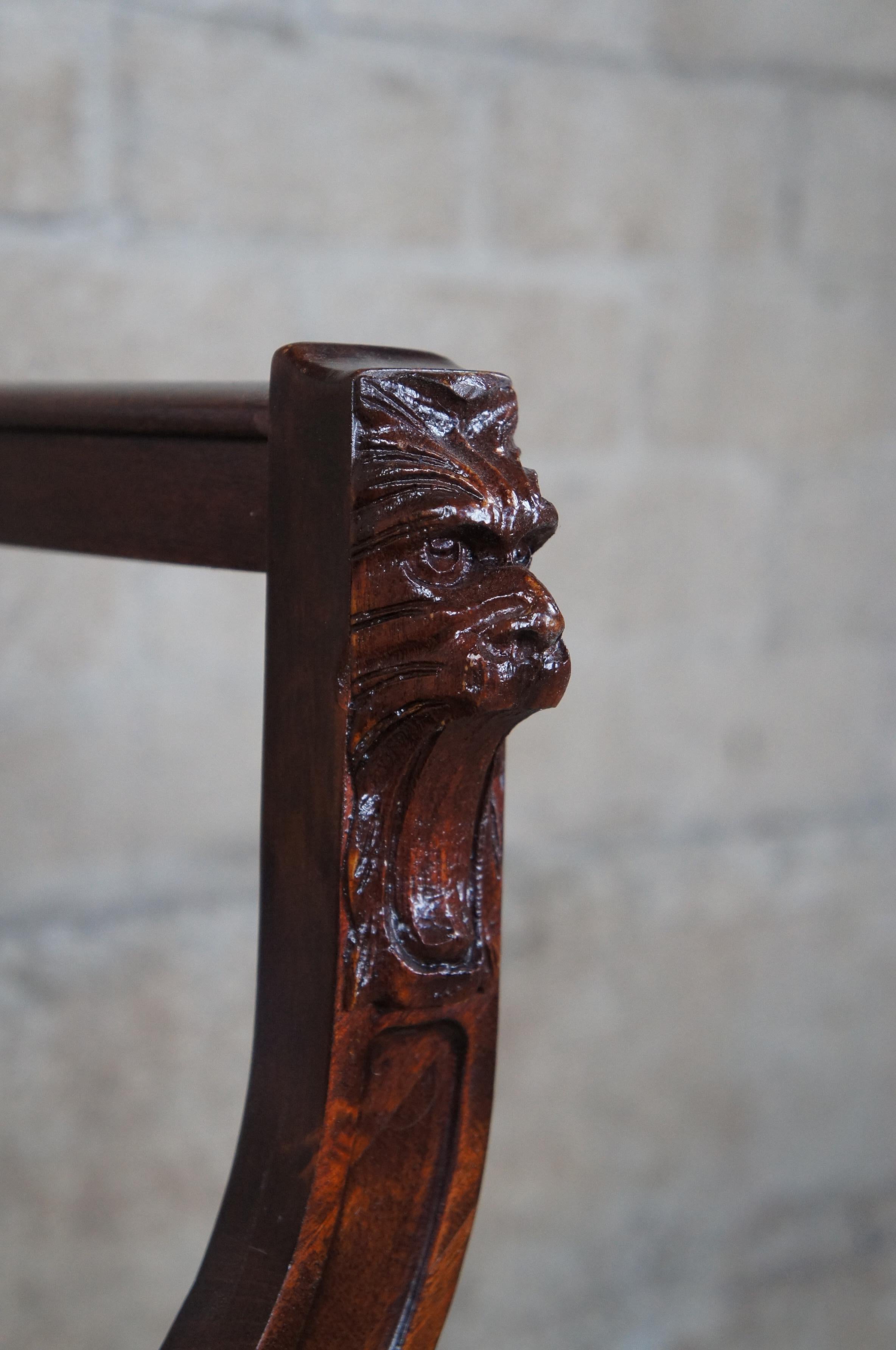 Antique Victorian Mahogany Figural Lion Head Carved Curule Saddle Seat Arm Chair In Good Condition For Sale In Dayton, OH