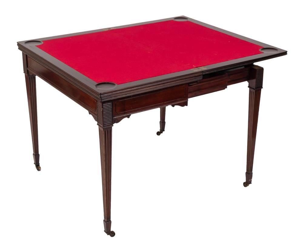 This is a fabulous high quality antique Victorian mahogany metamorphic triple top games table for cards and roulette, circa 1870 in date.

The hinged triple top opens to reveal the original red baize lined gaming interior for playing cards with