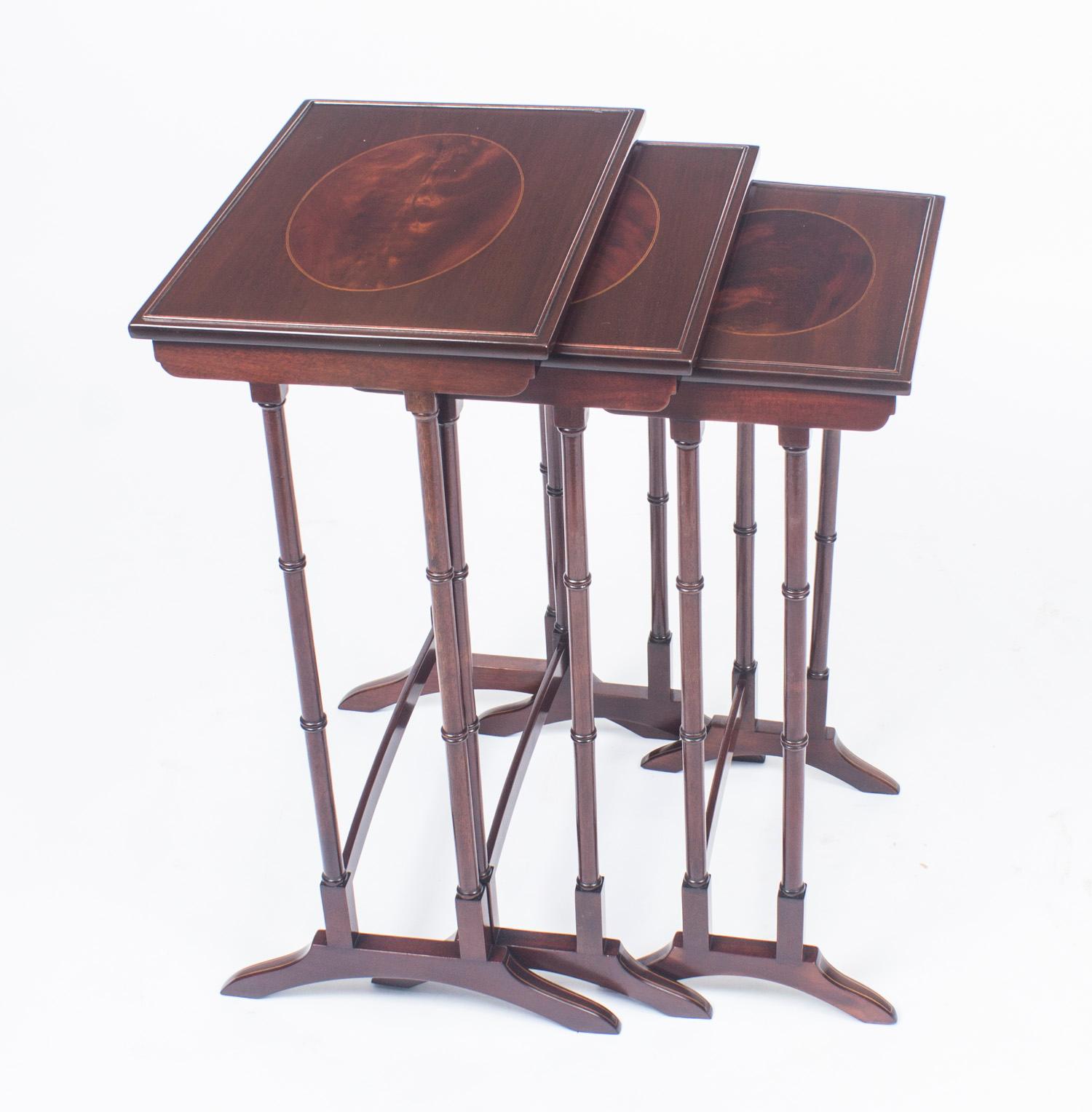 This is a beautiful antique Edwardian mahogany and inlaid nest of tables, circa 1880 in date. 

The nest consists of a set of three matching interlocking tables, each has a rich flame mahogany ovel inlaid panel surrounded by ebony and boxwood
