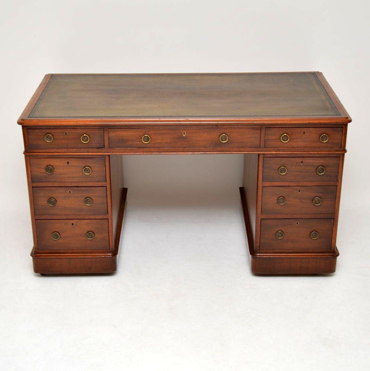 Medium sized antique Victorian pedestal desk from the 1860-1880s period, in mahogany with a tooled leather writing surface. It’s in good condition, having just been fully restored and French polished. The drawers which are graduated in depth, have