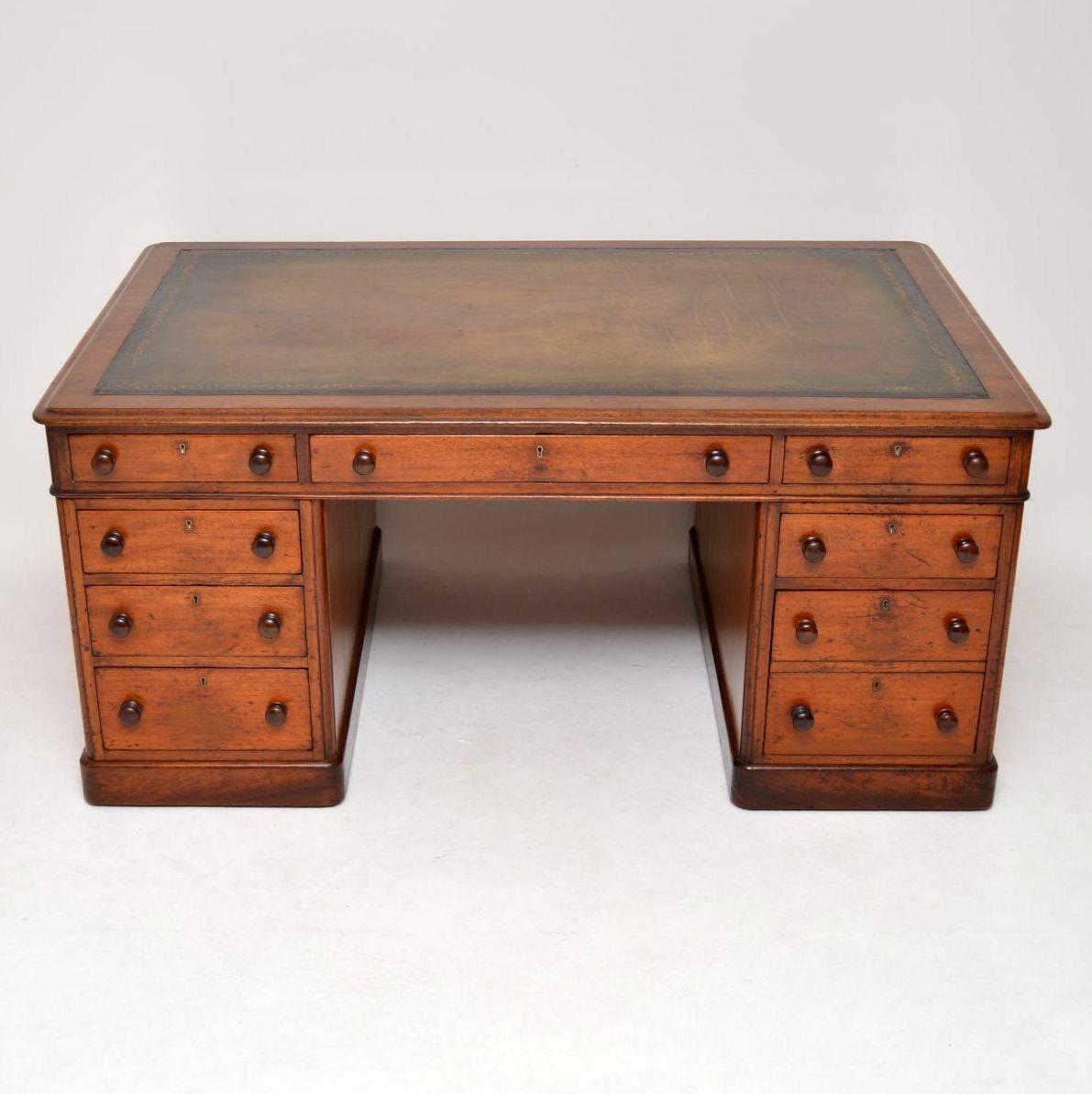This antique Victorian mahogany partners desk is full of character and has natural ageing on parts of the surface. It’s in good original condition and free from splits or warps. The leather top is a hand colored one piece hide and it’s hand tooled.