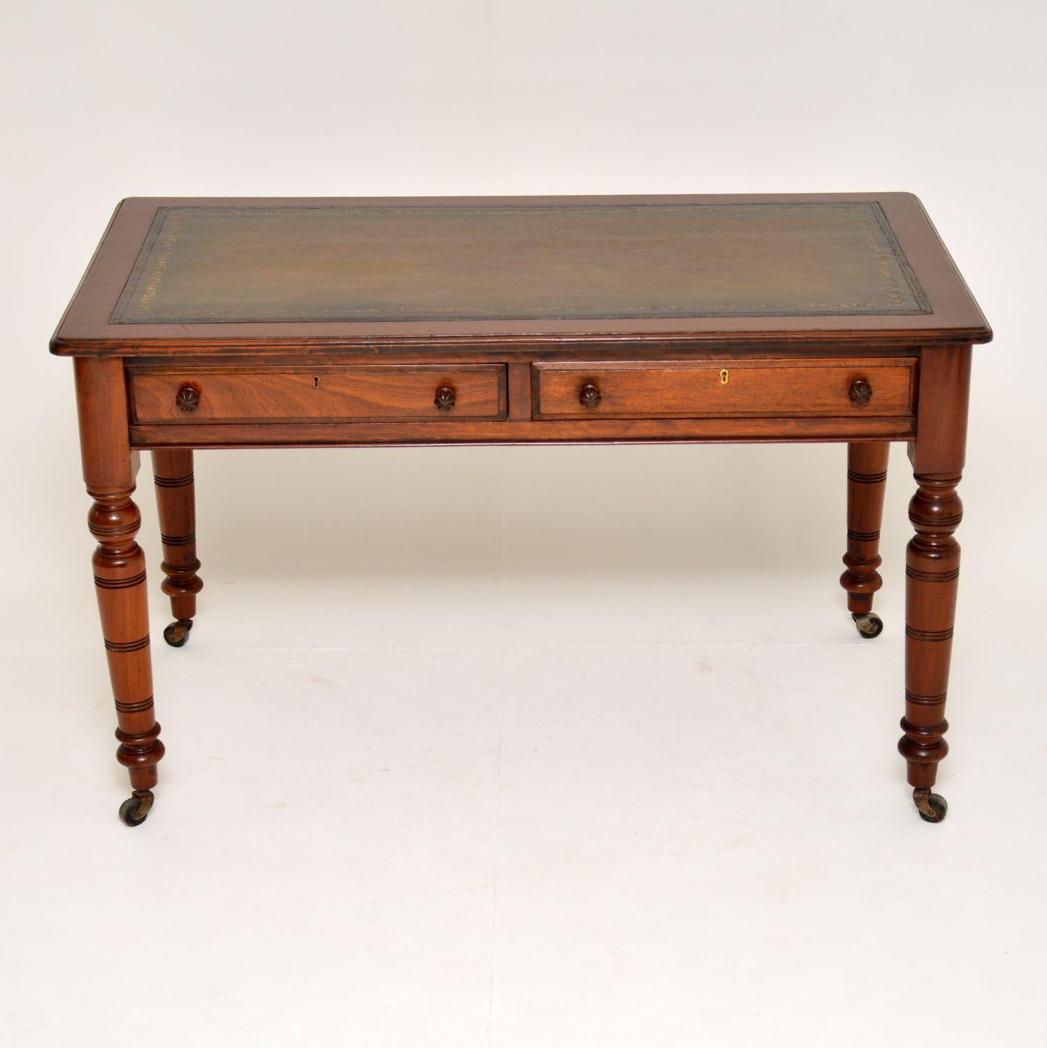 This antique mahogany writing table is a very strong looking piece of furniture & very well made too. It’s in excellent condition & dates from circa 1880s period. The tooled leather writing surface is a warm greenish, brown color & has lots of