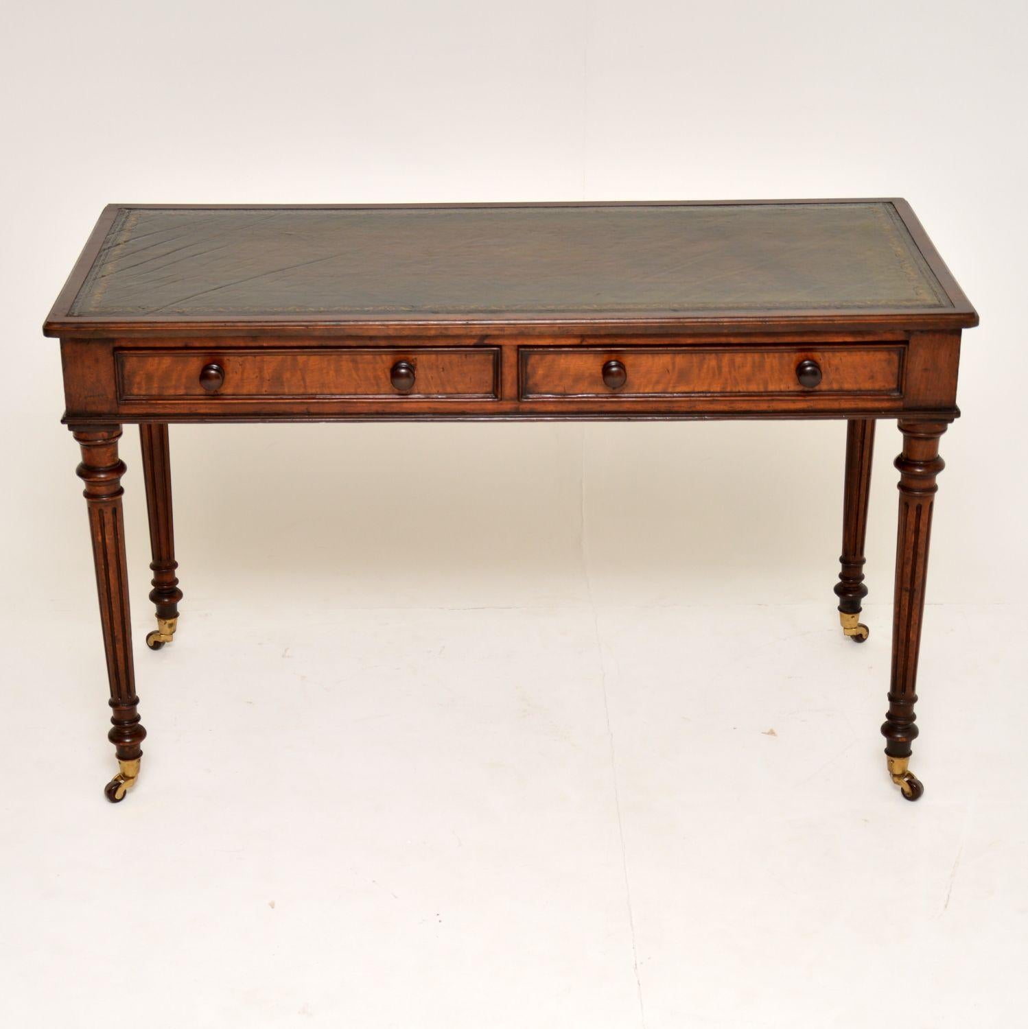This antique early Victorian mahogany writing table is in very good condition and is full of character, with a nice patina. It has the look of a ‘Gillows’ piece with the elegant proportions and reeded turned legs on brass cupped porcelain casters.
