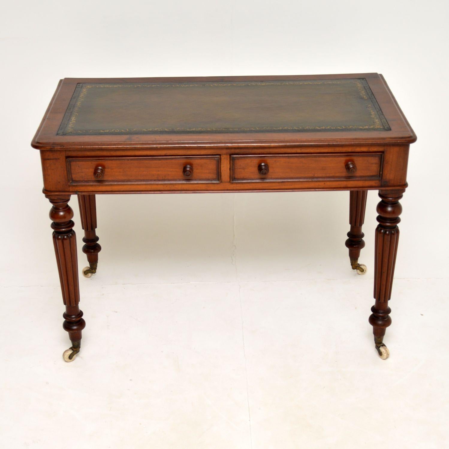 An excellent Victorian leather top writing table in mahogany. This dates from around the 1840-60’s period.
This desk is of super quality & beautifully made from solid mahogany. It has well turned and fluted legs, terminating in original white