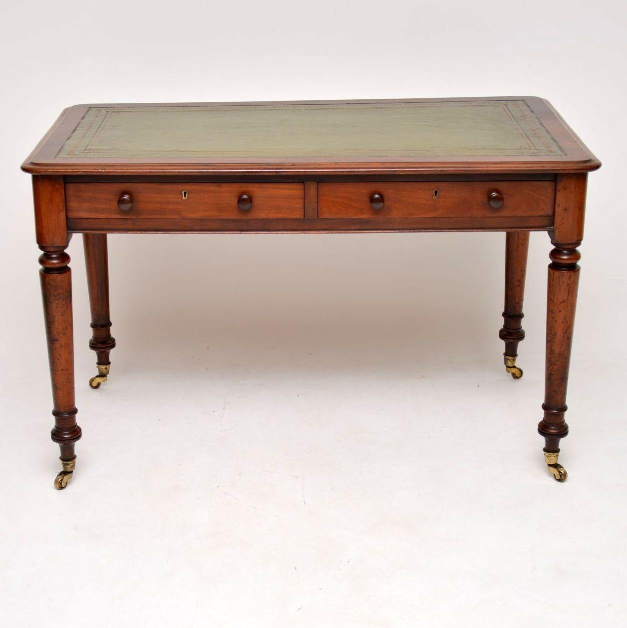 Antique early Victorian mahogany leather top writing table of slightly large proportions than the average one we get. It’s in good original condition and also has lots of character. This desk is polished on the back and has a tooled leather writing