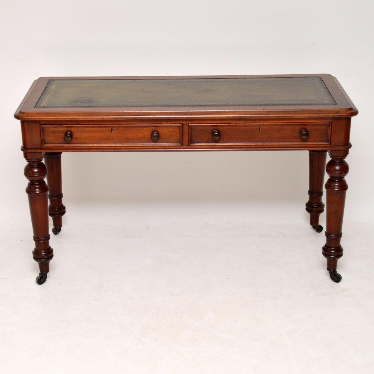 Antique Victorian leather top writing table desk in excellent original condition and of very high quality. It dates from around the 1860s-1880s period and is a very solid piece of furniture. The back is finished & polished, so it can sit out in a